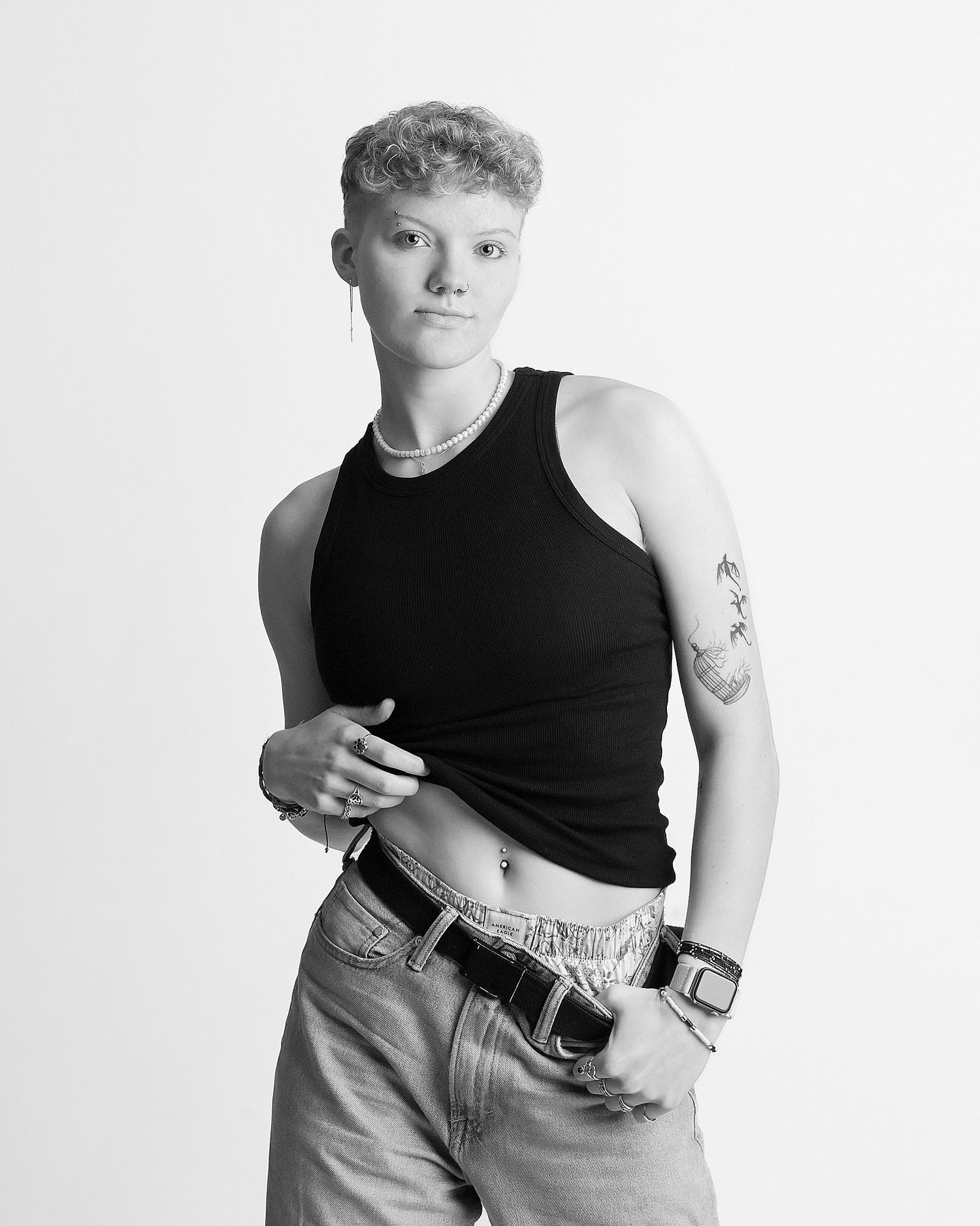 Black and white studio portraits showing different poses in casual attire.