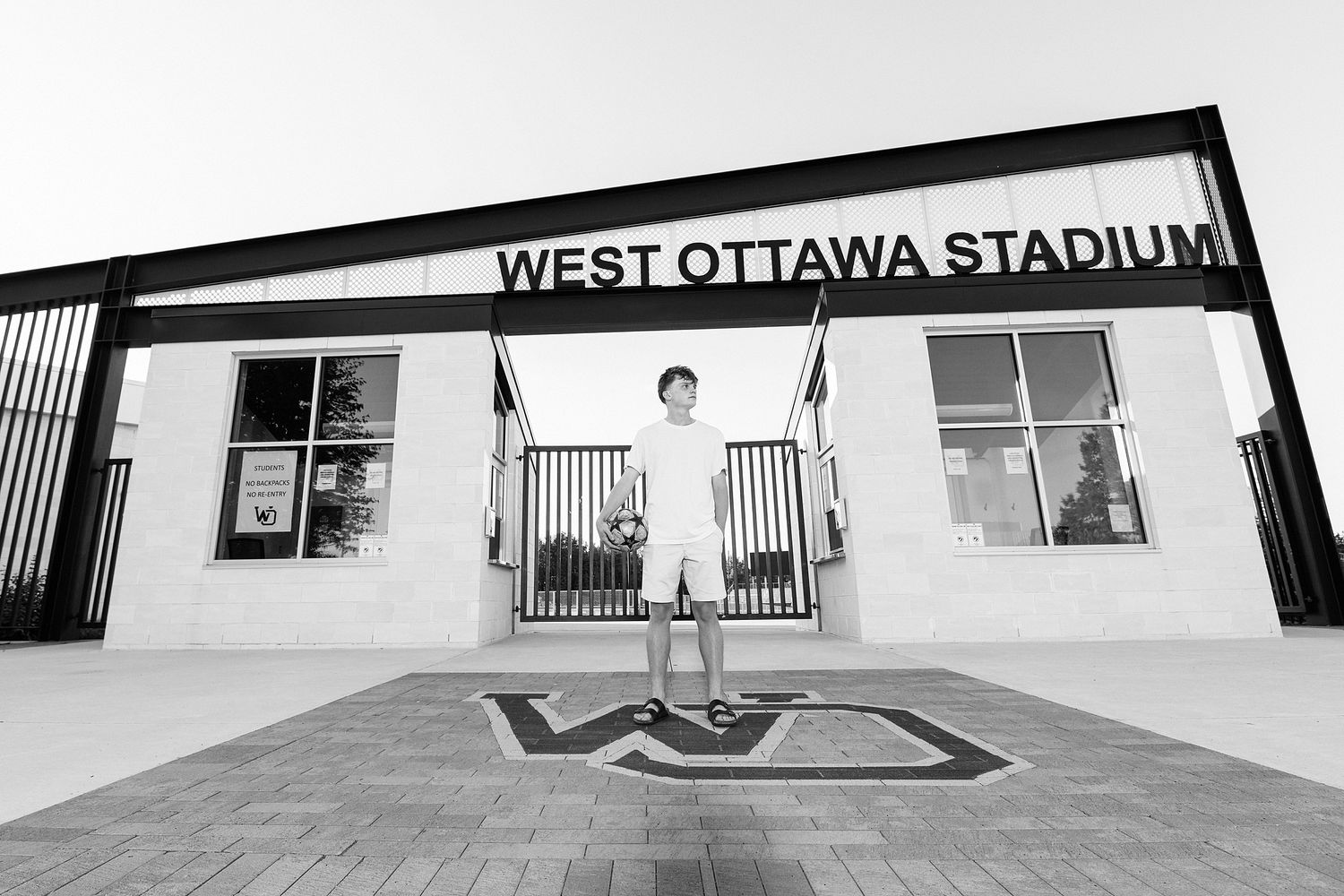 West Ottawa Stadium signage mounted on exterior wall of athletic facility.