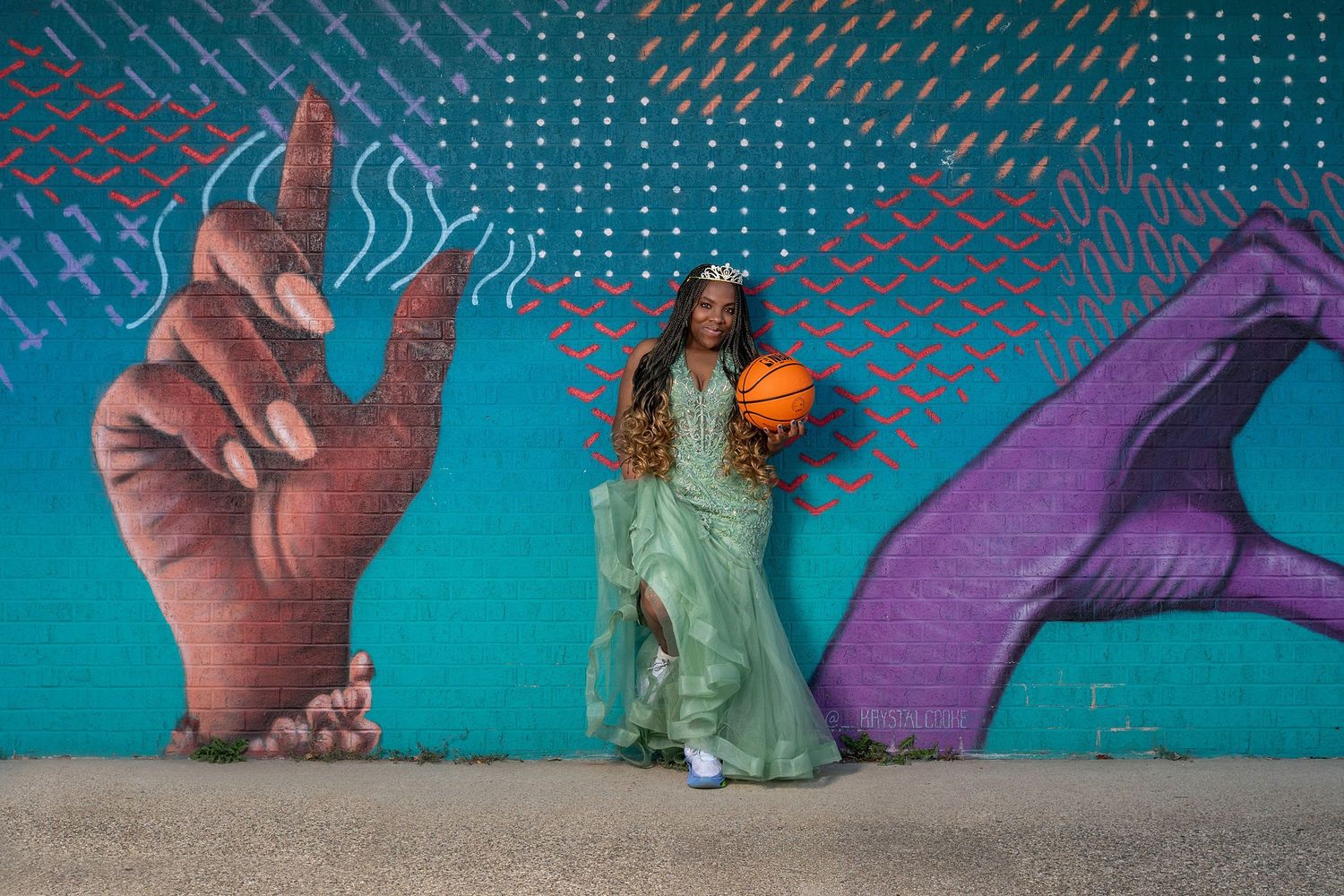 A creative photo series featuring hands making heart shapes against a turquoise wall.
