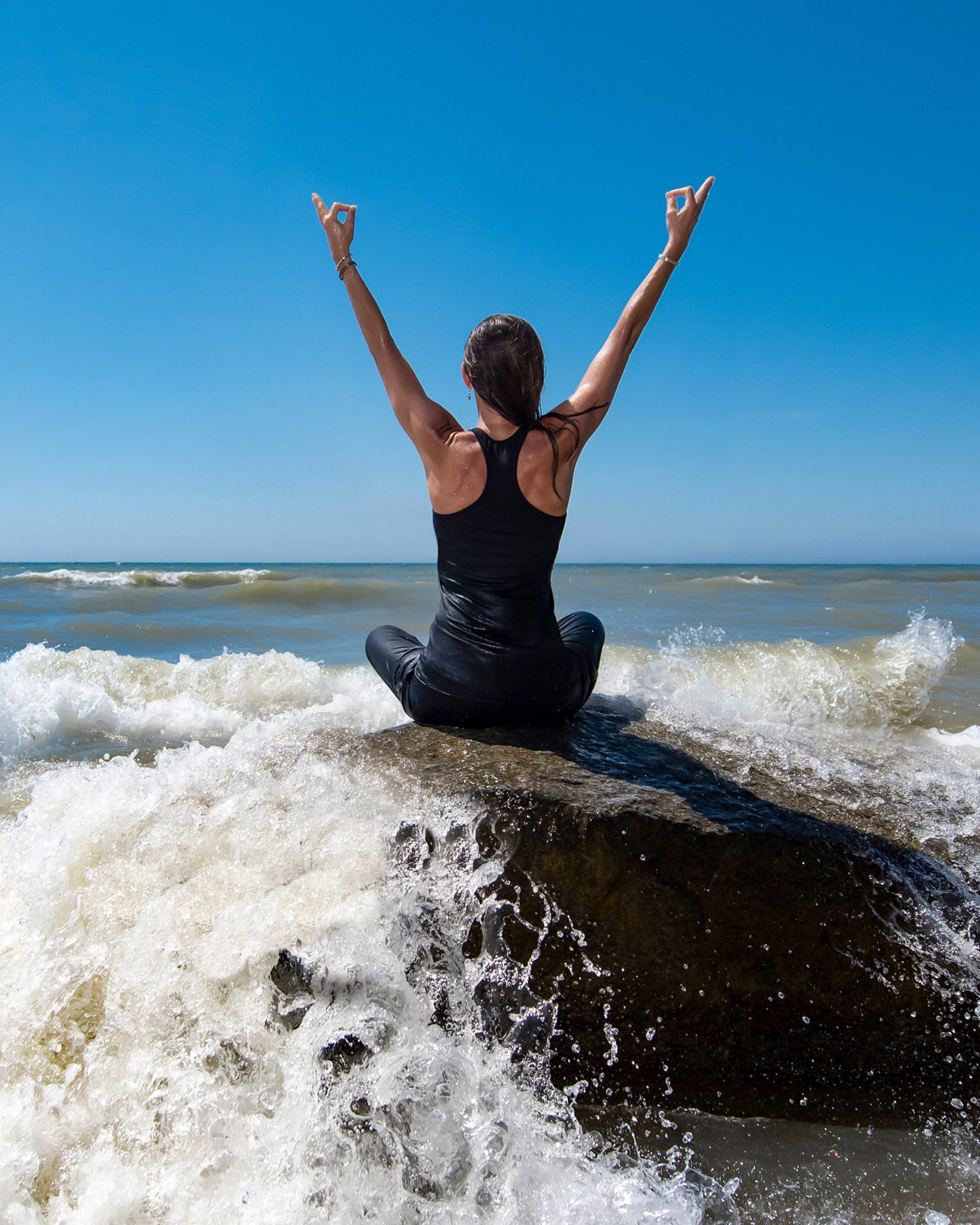 Action sequence of someone riding waves at the beach on a sunny day.