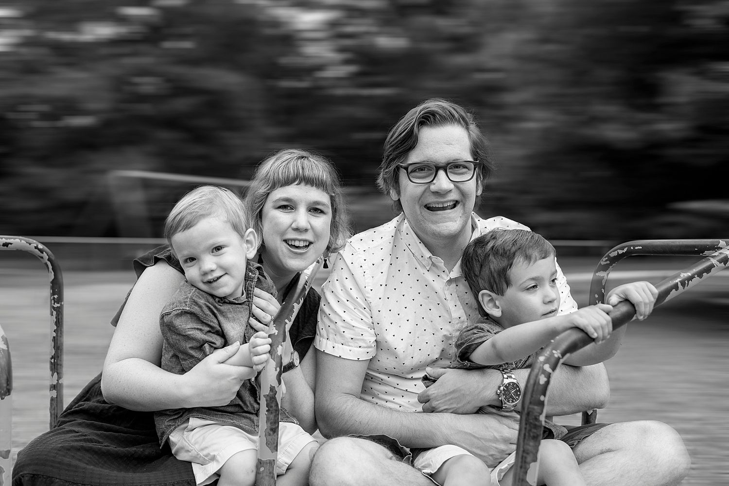 Black and white candid moments captured during an outdoor family gathering.