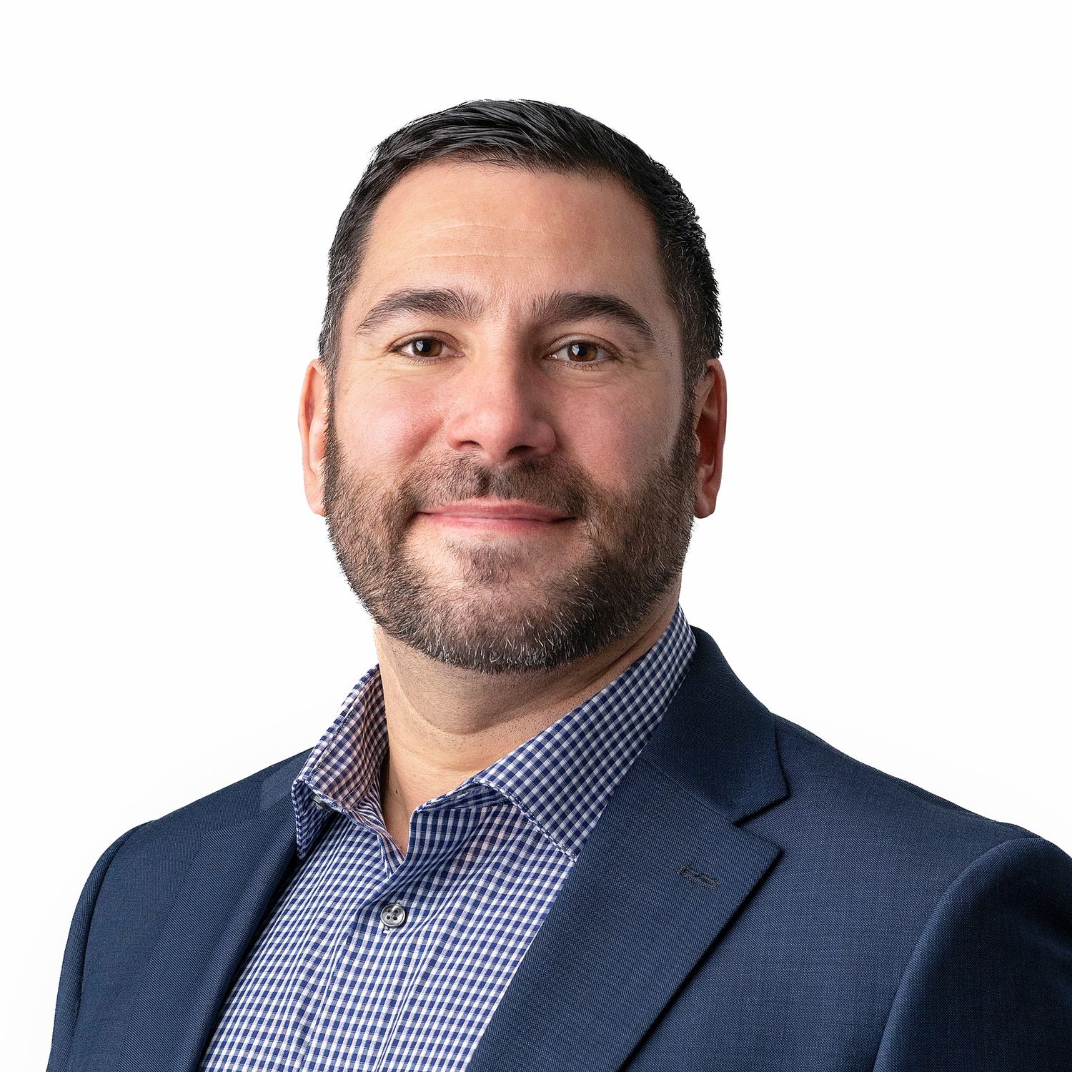 Professional headshot of person in blue checkered shirt and navy blazer against white background.