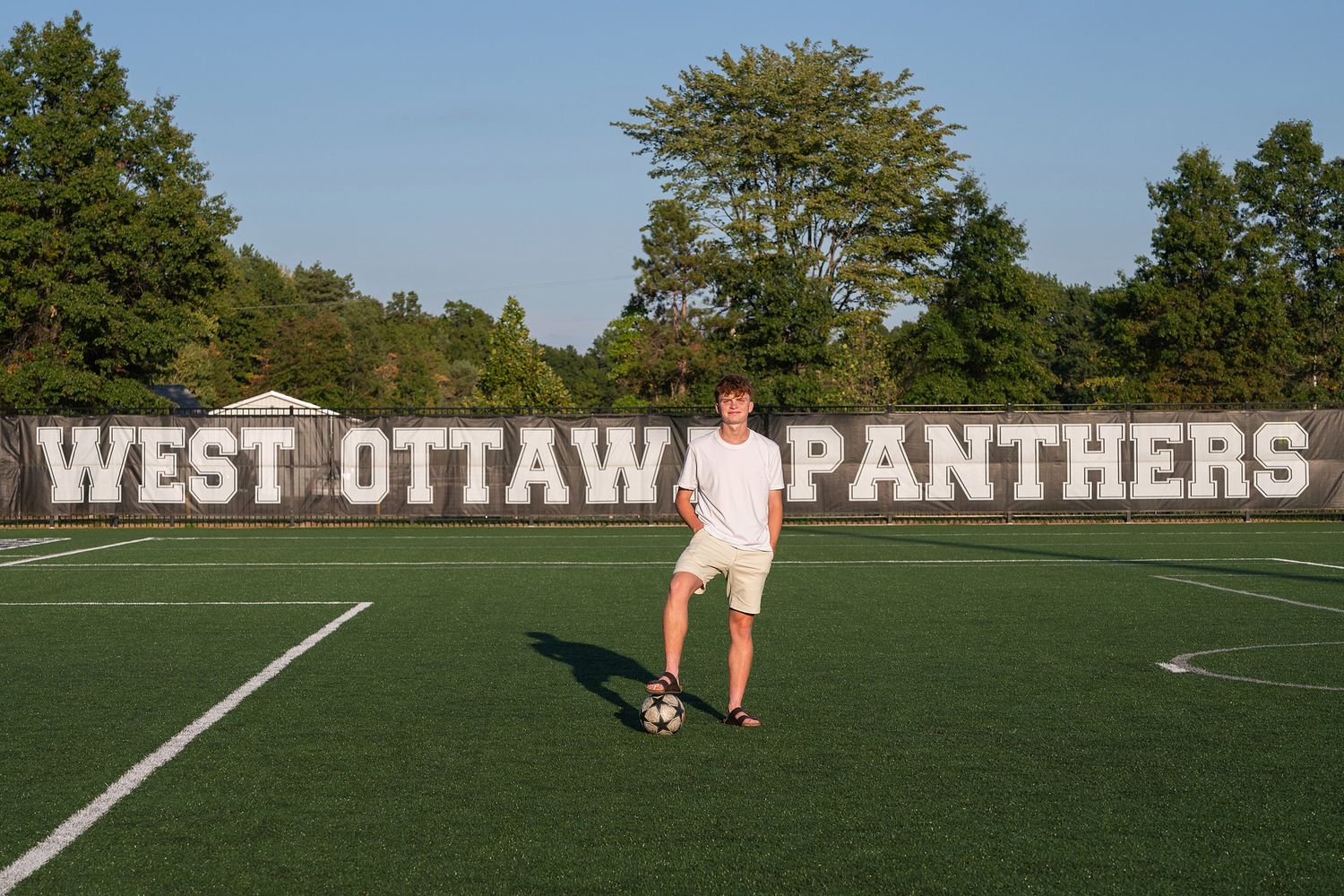 Football field with West Ottawa Panthers signage visible in background.