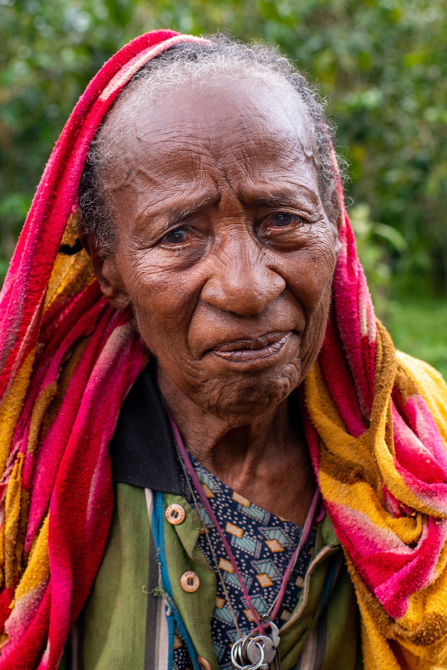 Progressive shots of someone wearing a vibrant red and yellow head covering with expressive facial expressions.