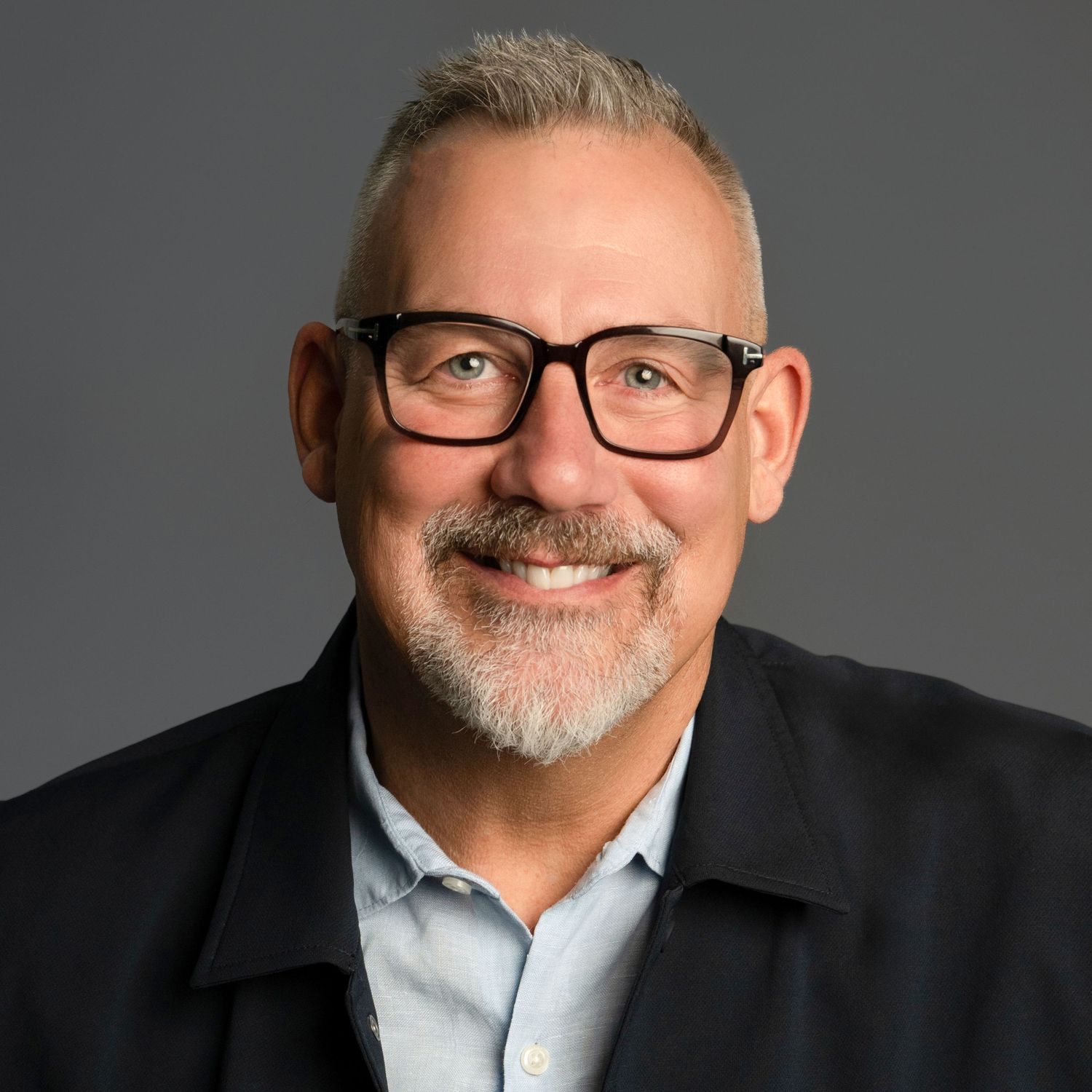 Professional headshot series showing person in business attire against grey backdrop.