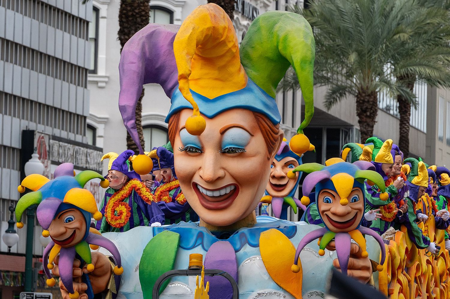 Vibrant carnival parade floats featuring whimsical character designs and bright colors.