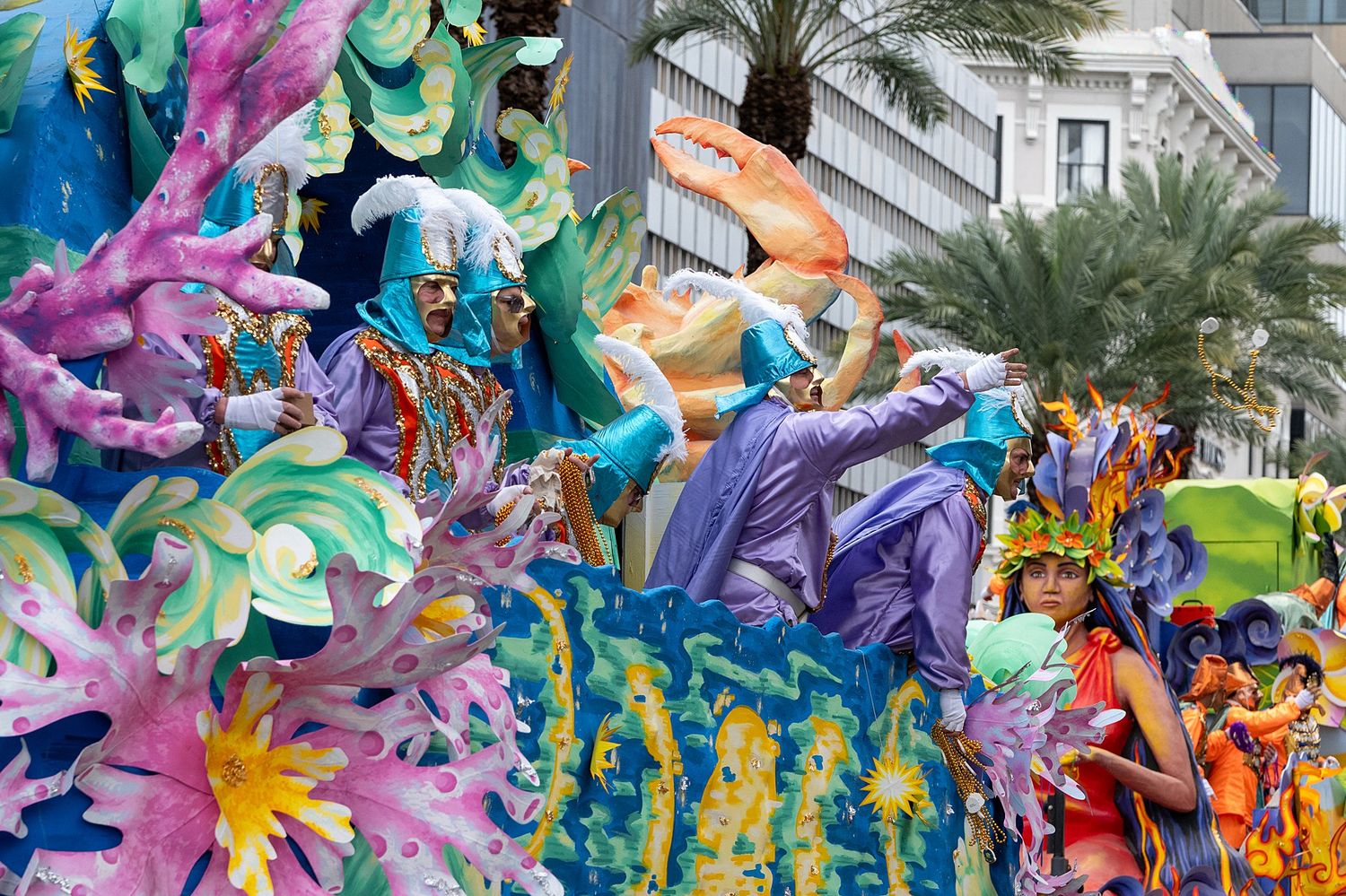 Colorful underwater-themed parade float with sea creatures and fantasy elements.