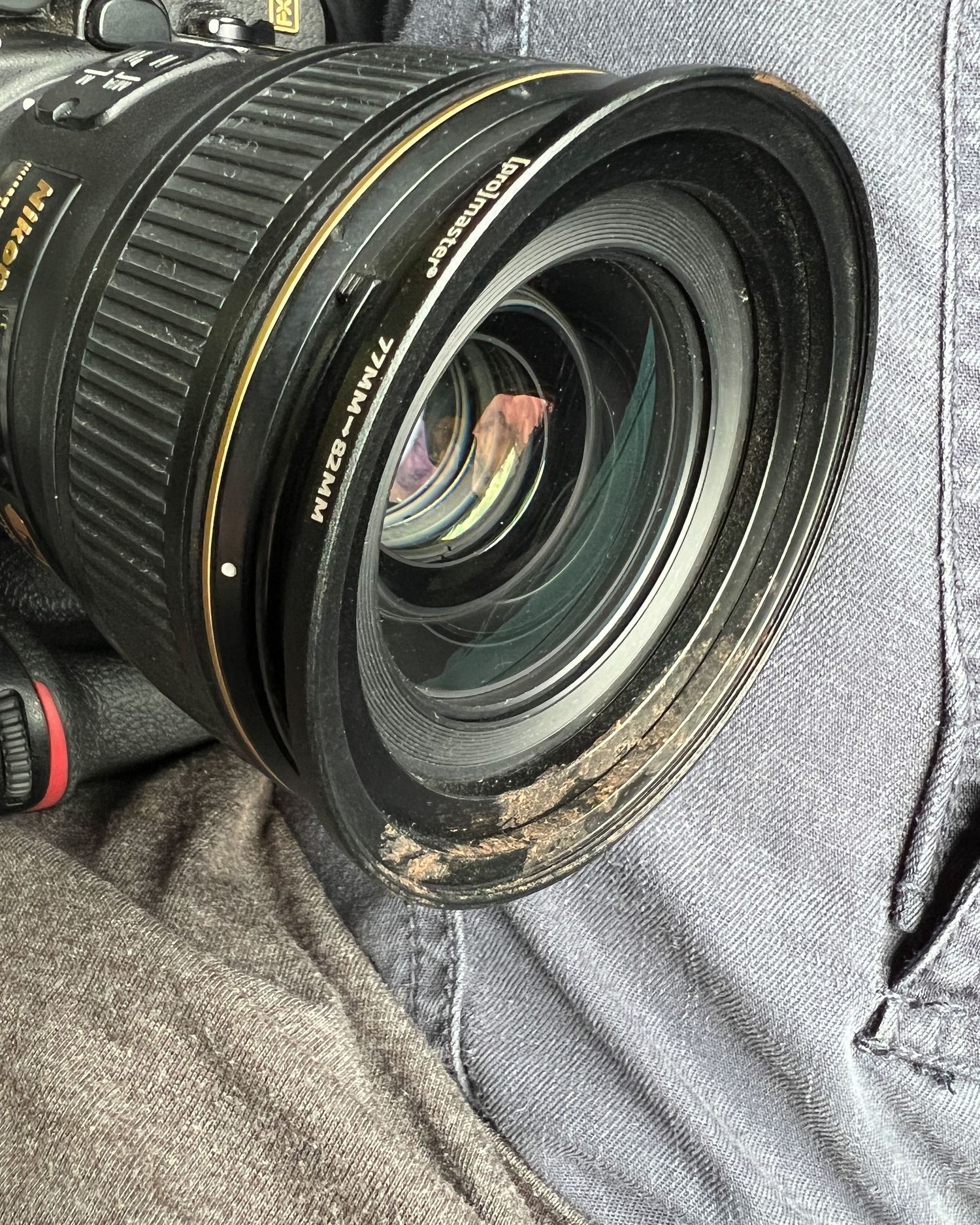 Close-up of professional camera lenses on grey fabric background.