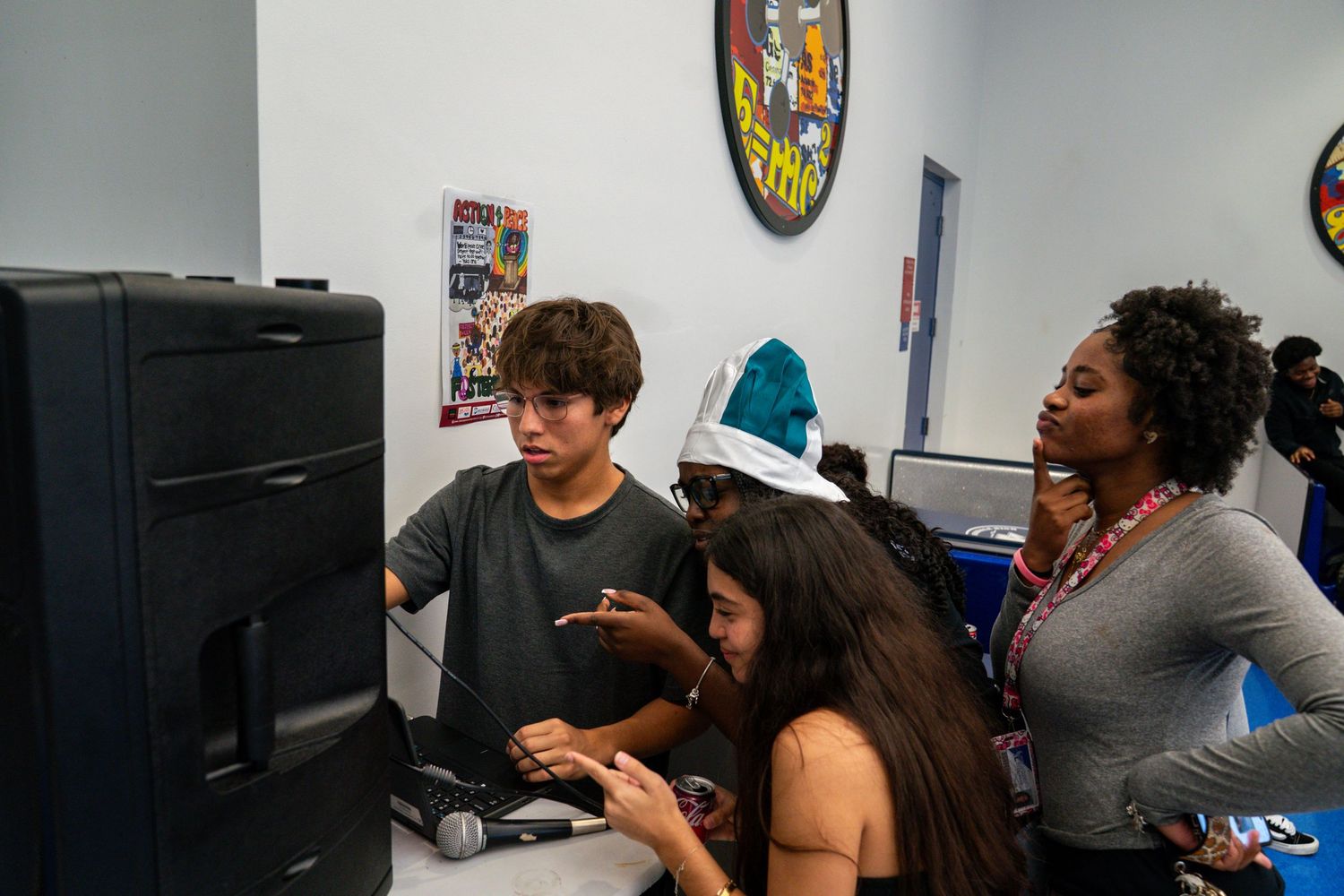 Students work together in a computer lab classroom setting.