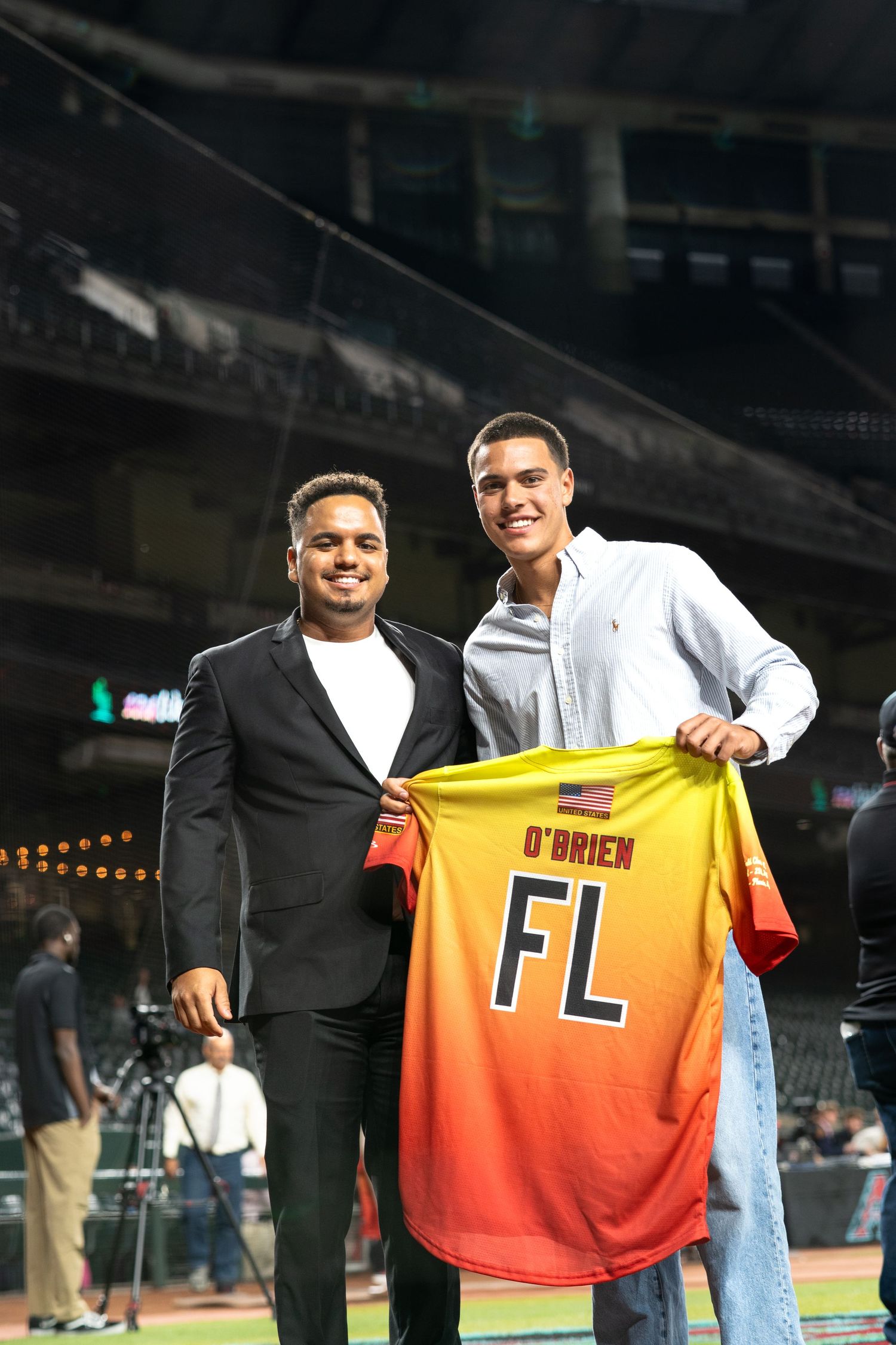 Display of orange sports jersey at stadium event.