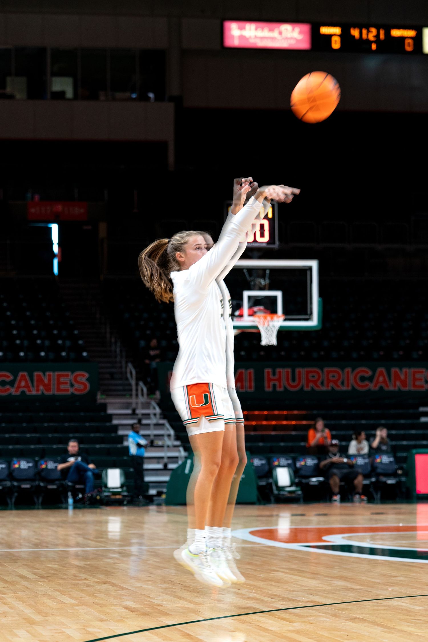 Basketball player takes jump shot during game against Miami Hurricanes.