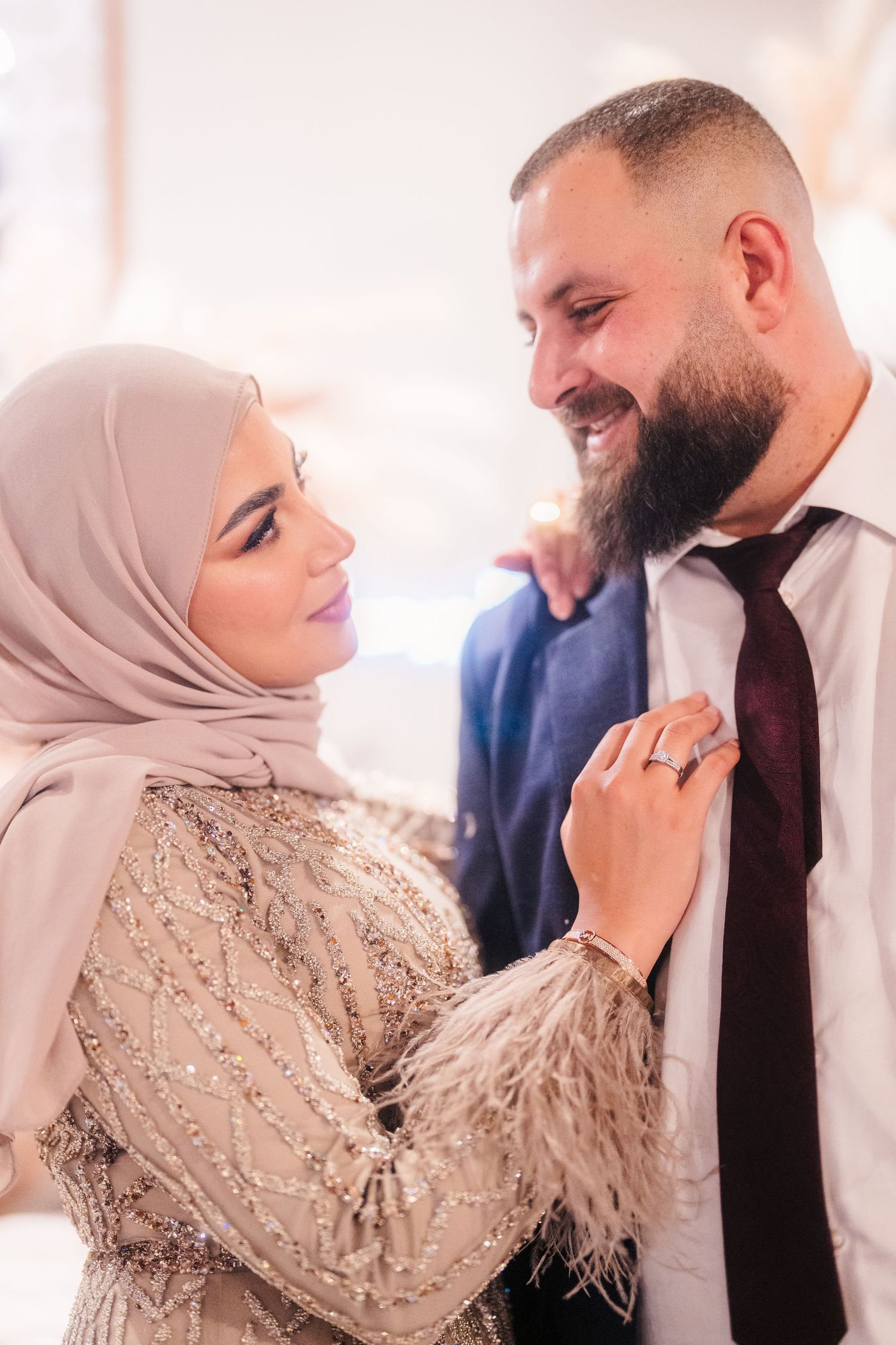 A romantic photo sequence shows a couple in elegant attire sharing tender moments against a light background.