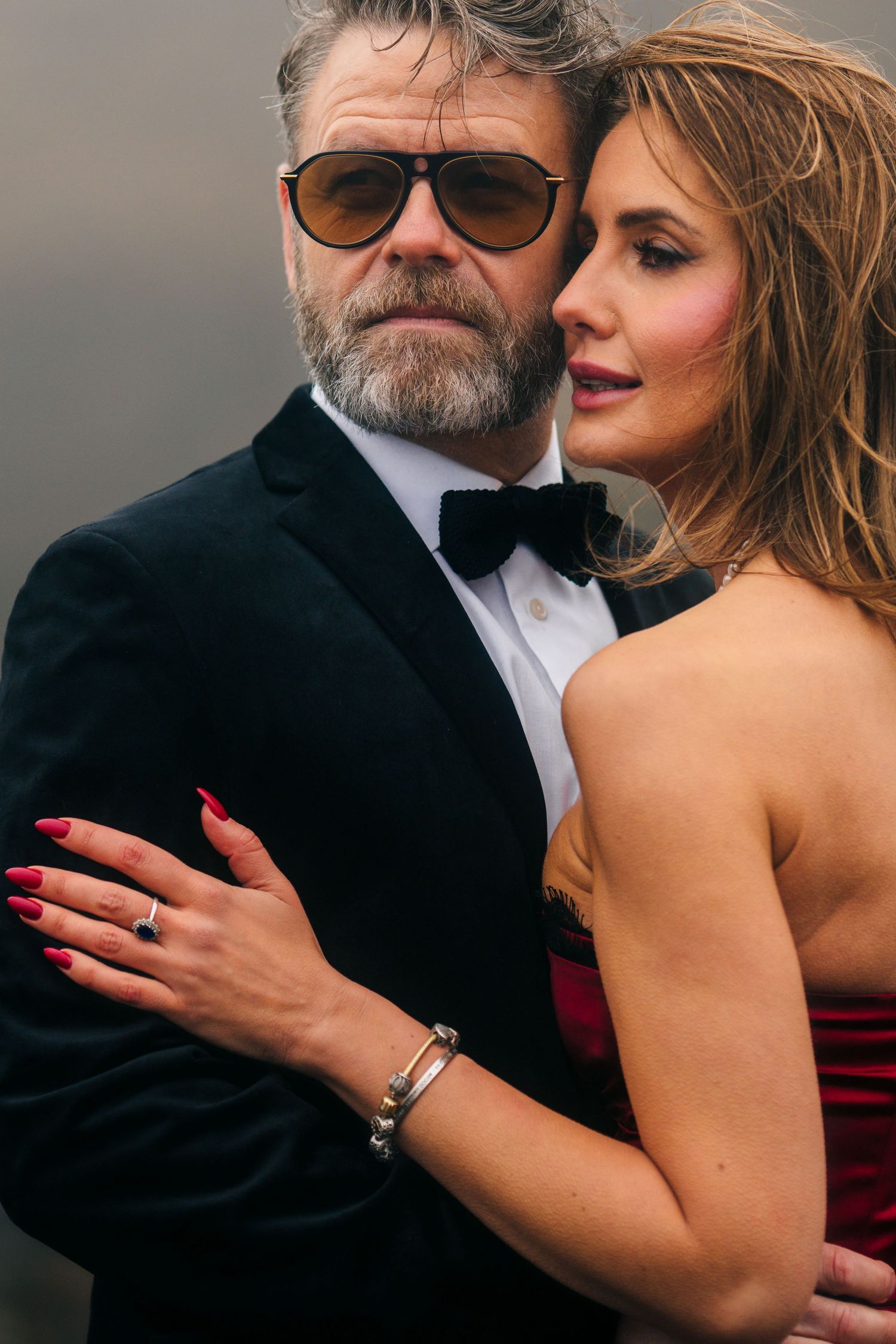 Iceland destination wedding. A romantic couple in formal attire embrace in a series of intimate black and white photographs.