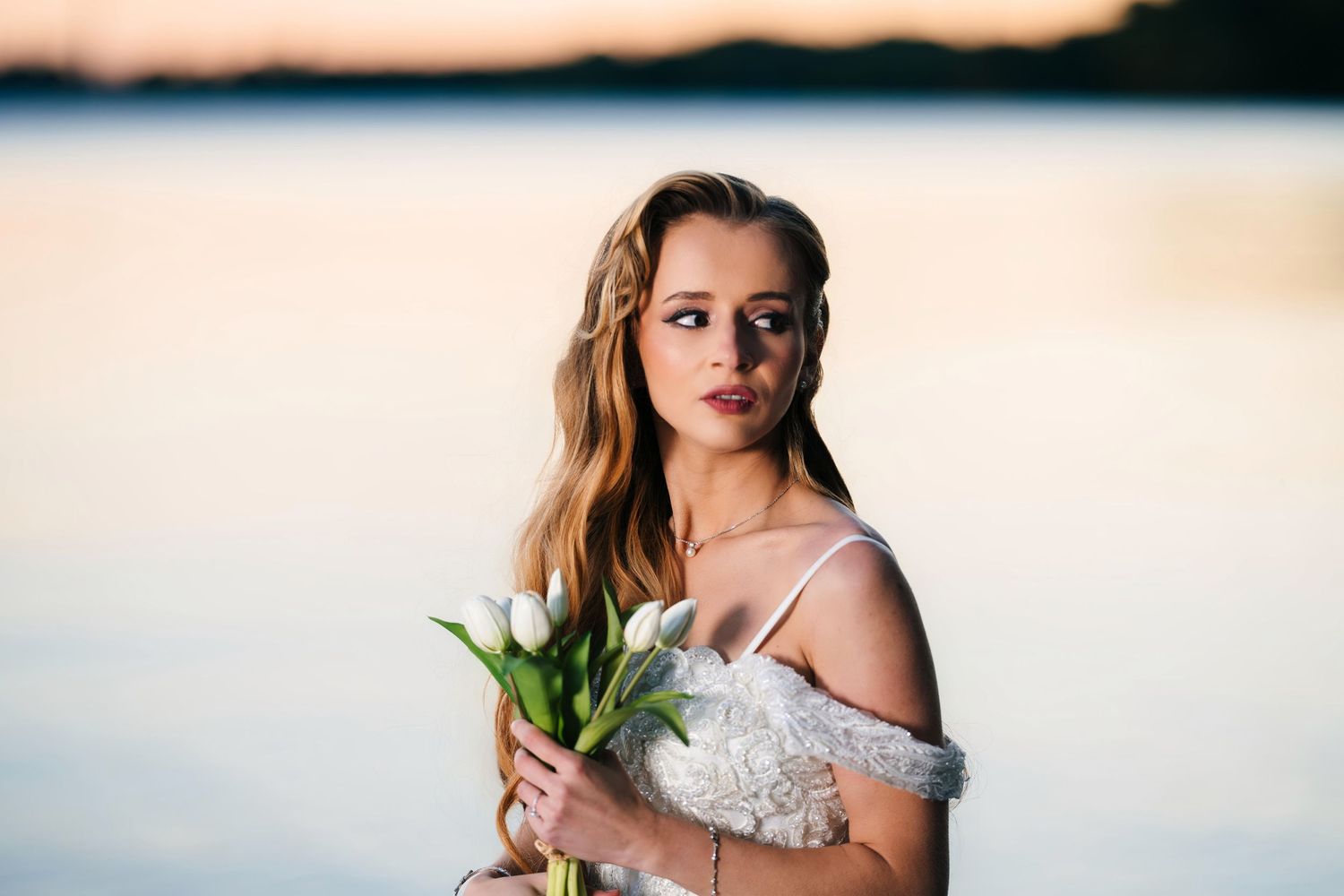 Mississauga bridal portrait. Romantic sunset beach wedding photos showing bridal portraits and floral bouquets in warm golden light.