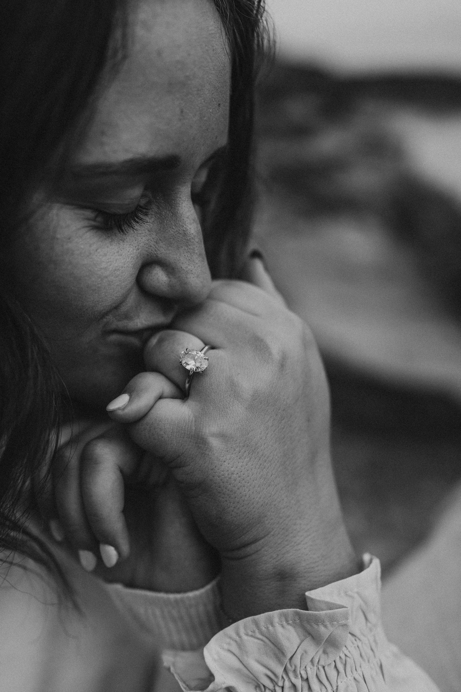 Bride kissing brides hand in Iowa engagement photos
