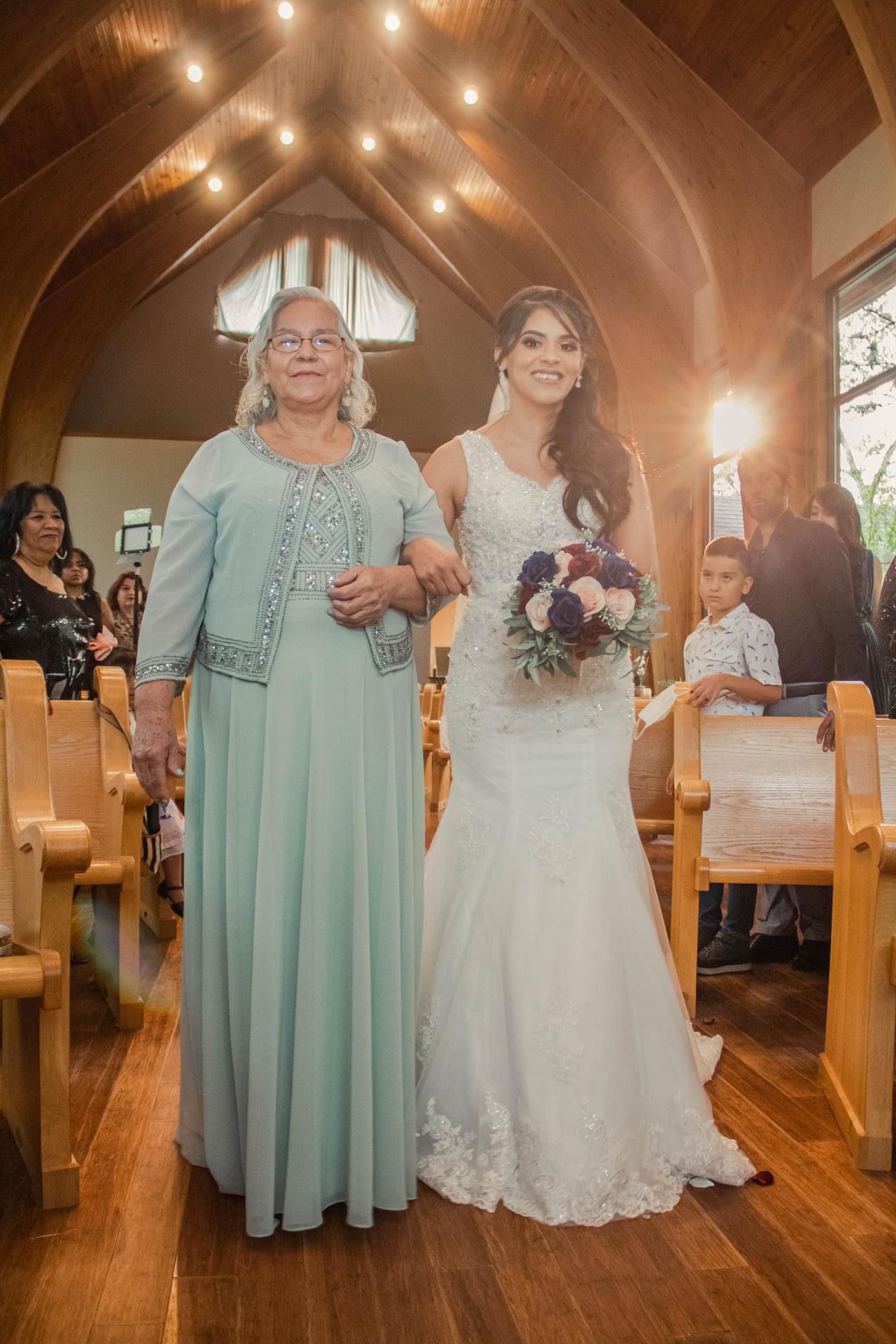 Traditional church wedding ceremony with wooden beams and warm lighting.
