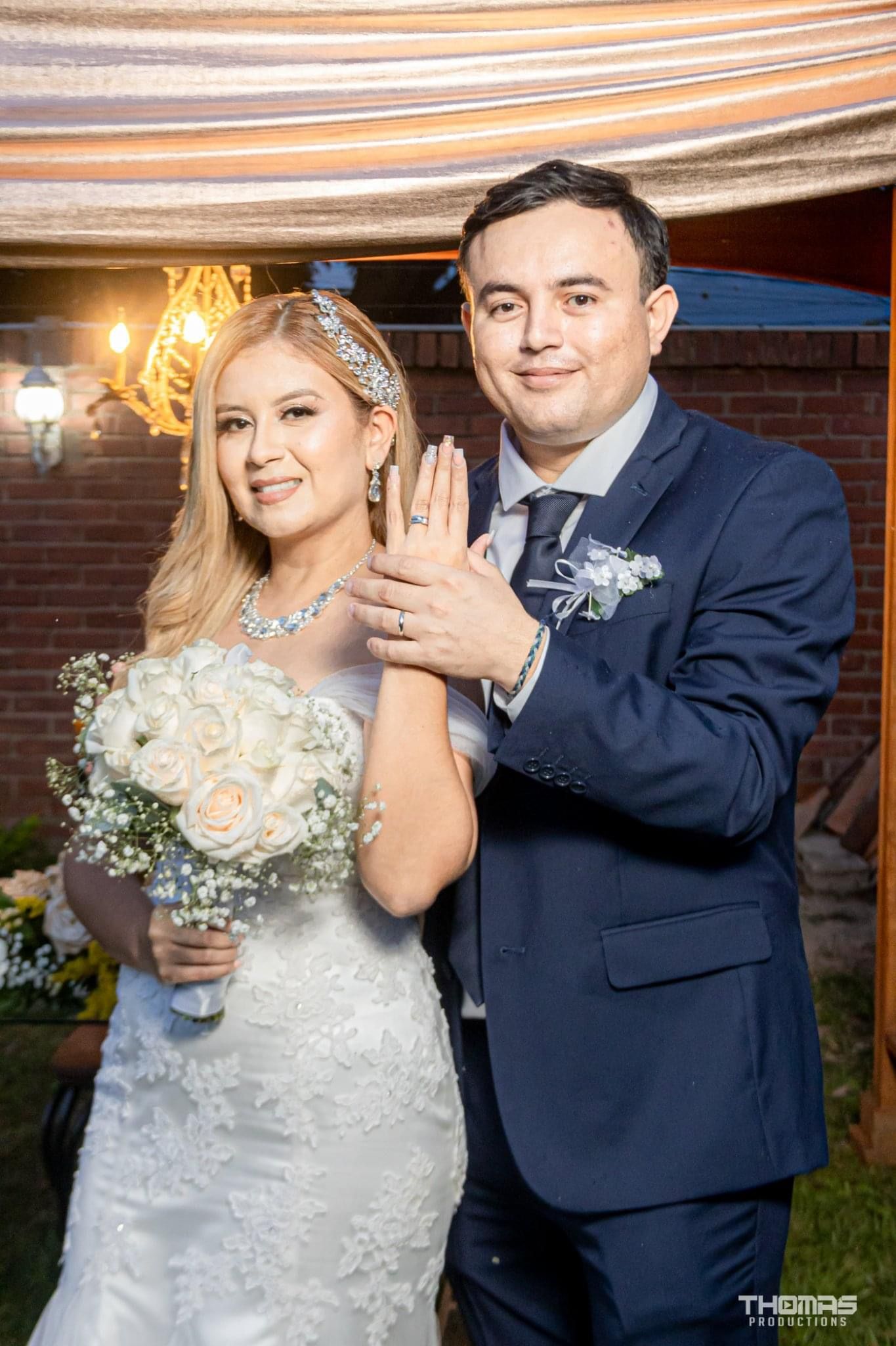 A newlywed couple shows off their wedding rings in a series of joyful poses.