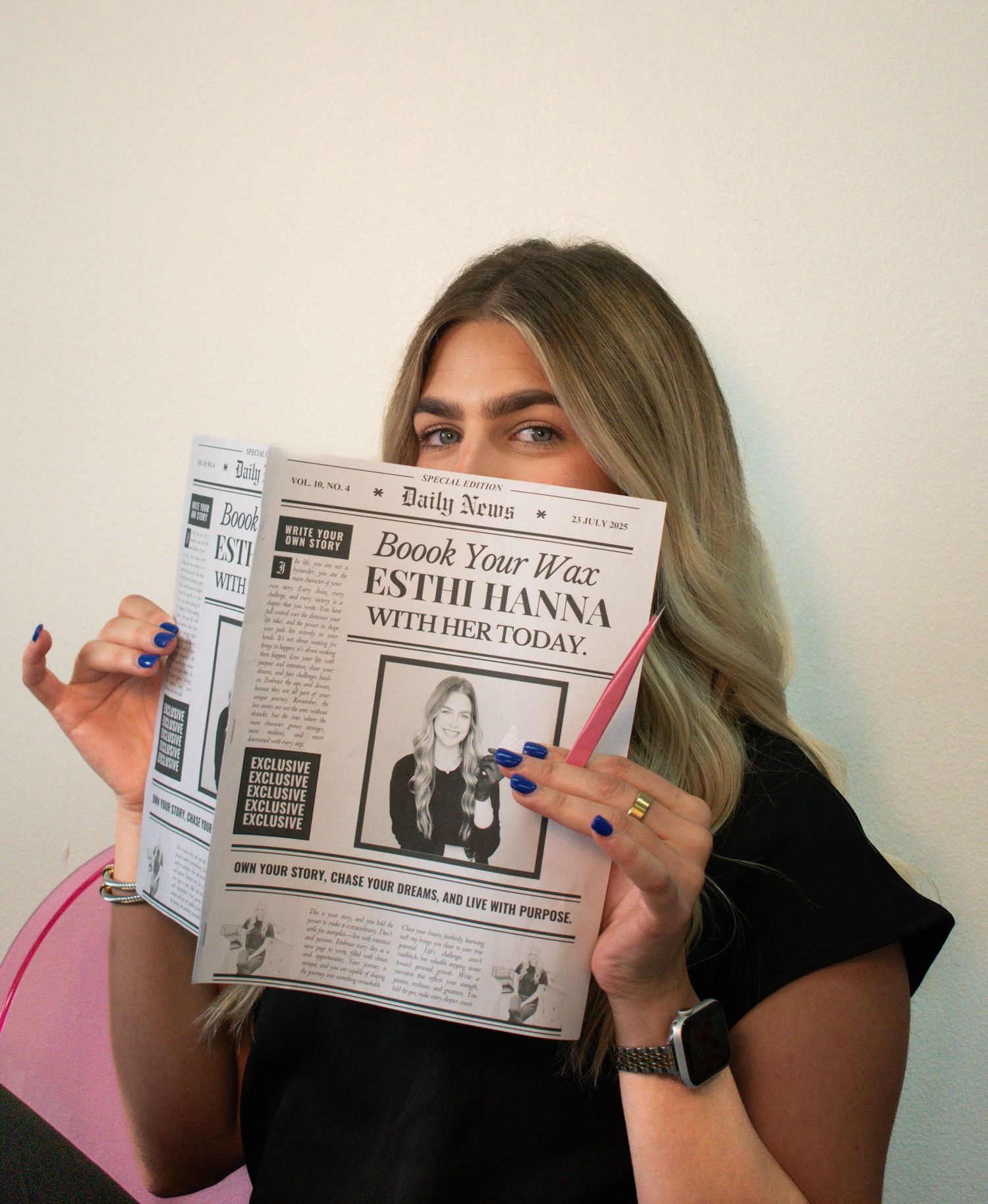 Young blonde woman holding a custom Daily News newspaper featuring wax specialist Esth Hanna advertisement.