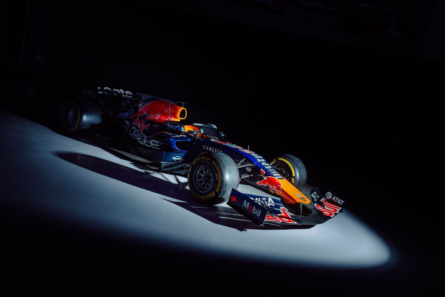 Red Bull Racing Formula 1 car under dramatic spotlight against a dark background