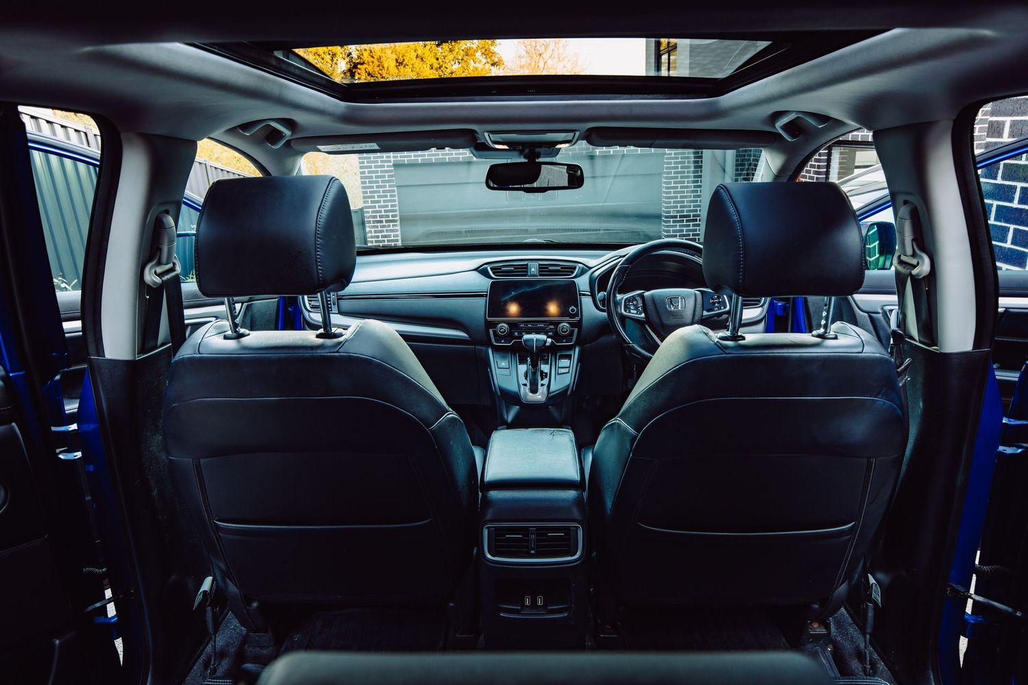 Honda CR-V interior with black leather seats and panoramic sunroof