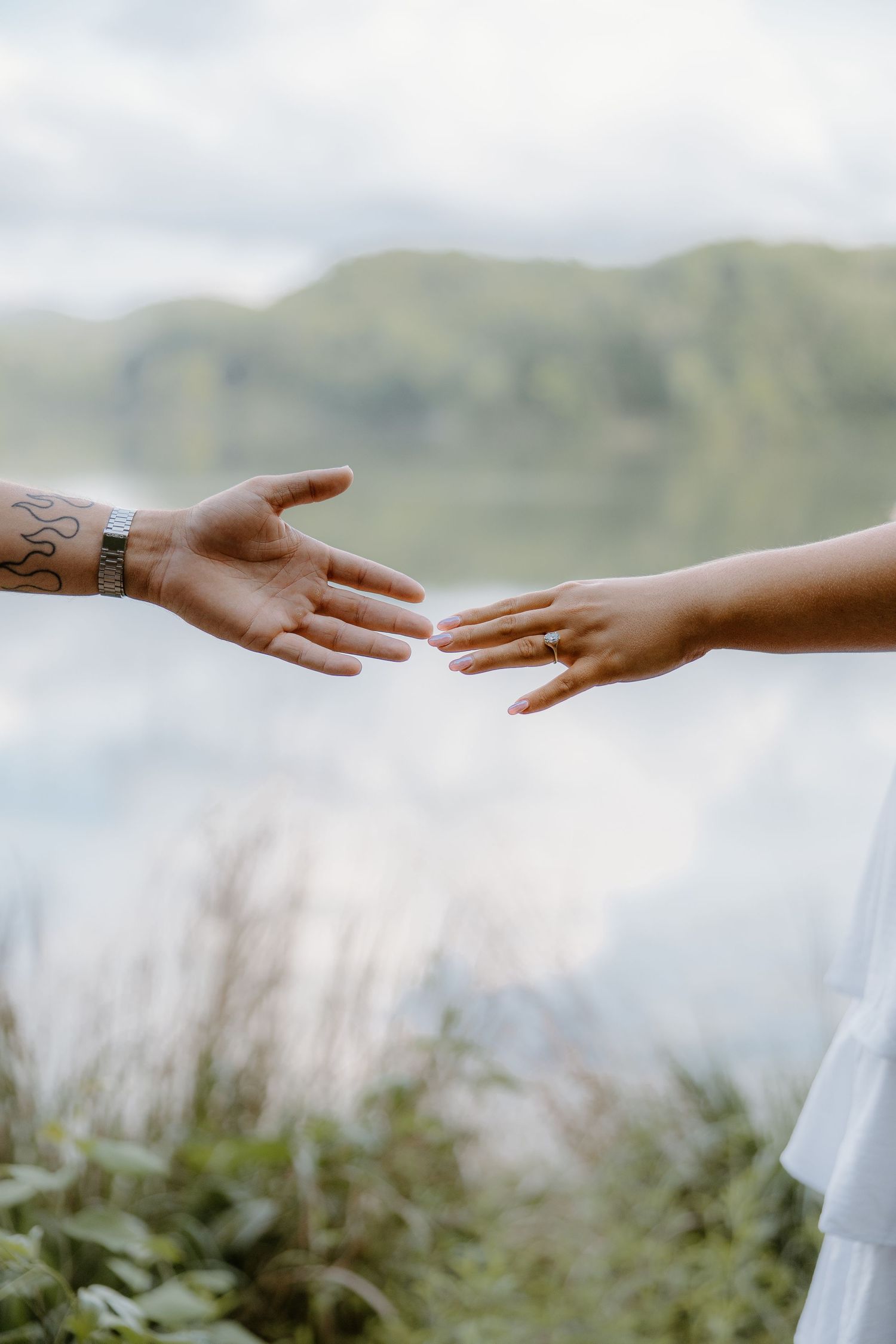 Wedding couple holding hands during a romantic portrait session by an Arizona wedding photographer.