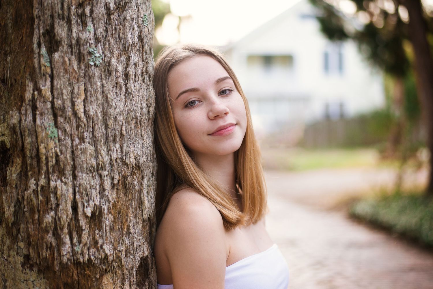 Outdoor senior portrait of teenage girl among trees — natural light photography by Alexandra Hall, Jacksonville and St Augustine FL