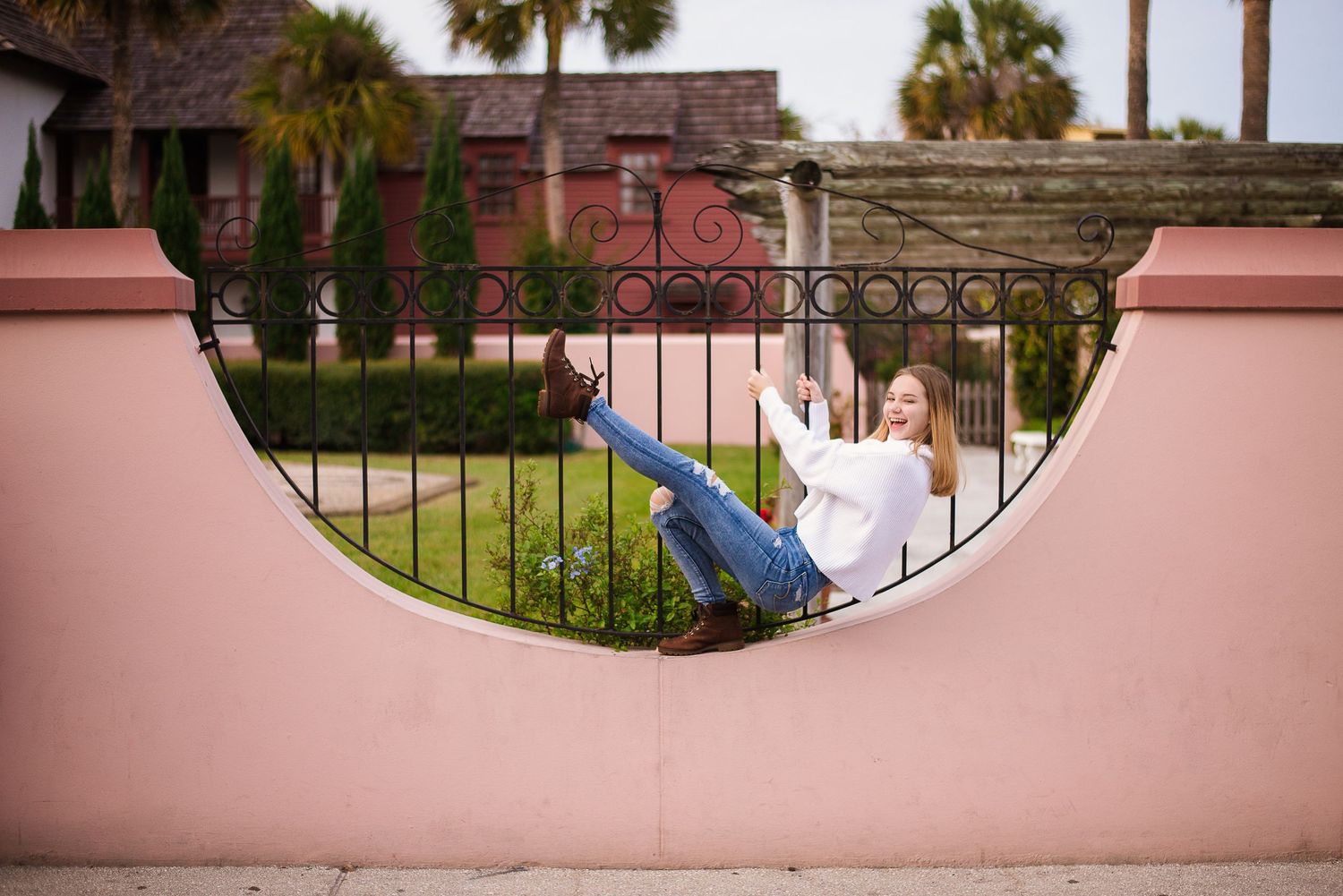 Senior portrait in iconic St. Augustine archway — natural light photography by Alexandra Hall, St. Augustine FL