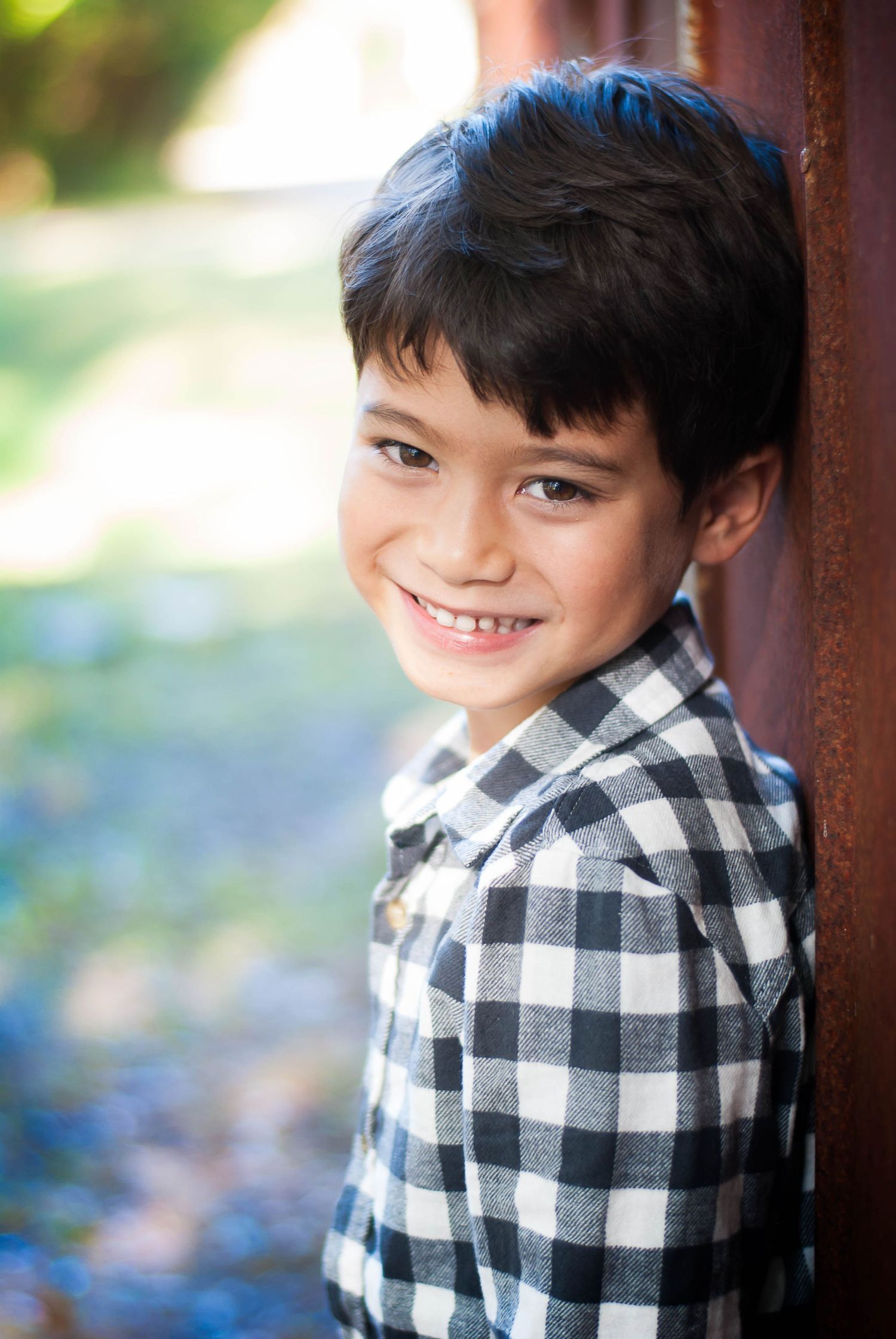 Outdoor portrait of young boy in natural light — candid child photography by Alexandra Hall, Jacksonville FL