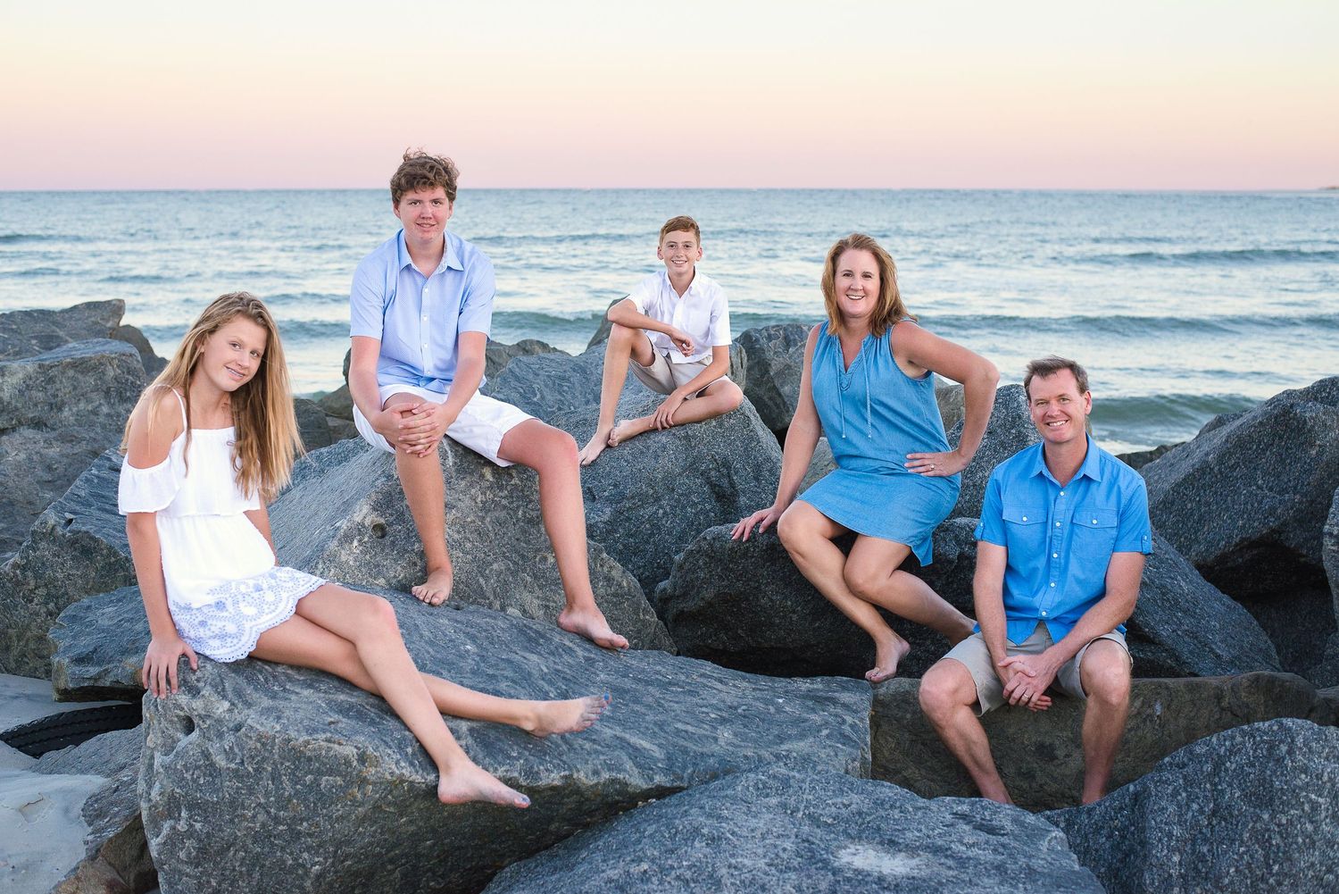Family portrait session on the rocks at golden hour, Vilano Beach FL — natural light photography by Alexandra Hall