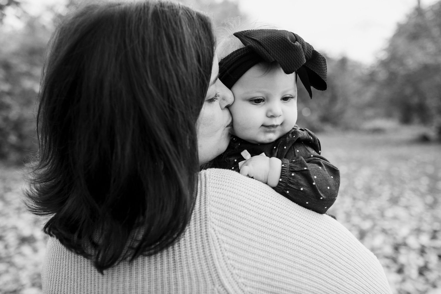 Mother kissing baby during mommy and me photography session, Rochester, NY