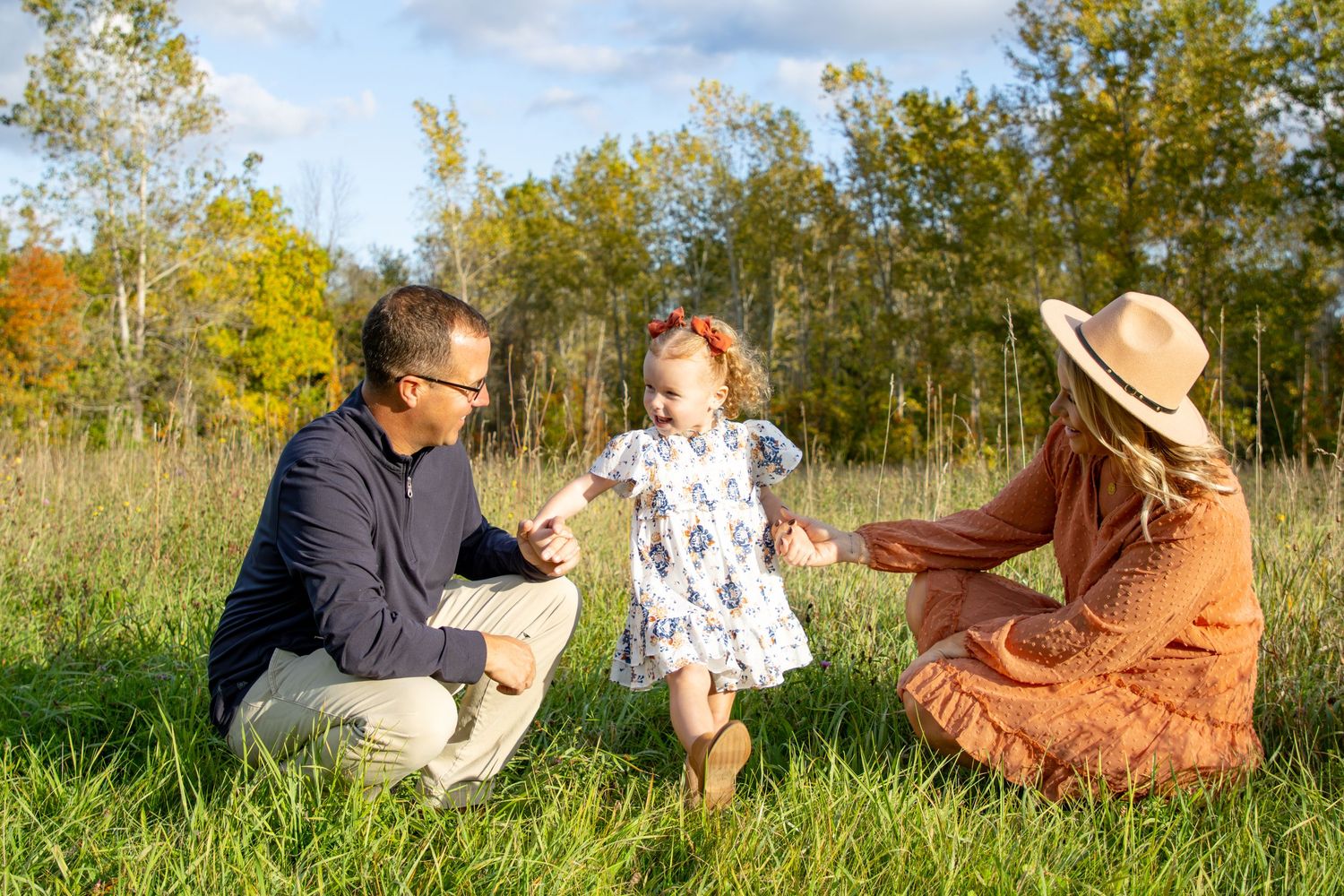 family mini session in Rochester NY with parents and young child