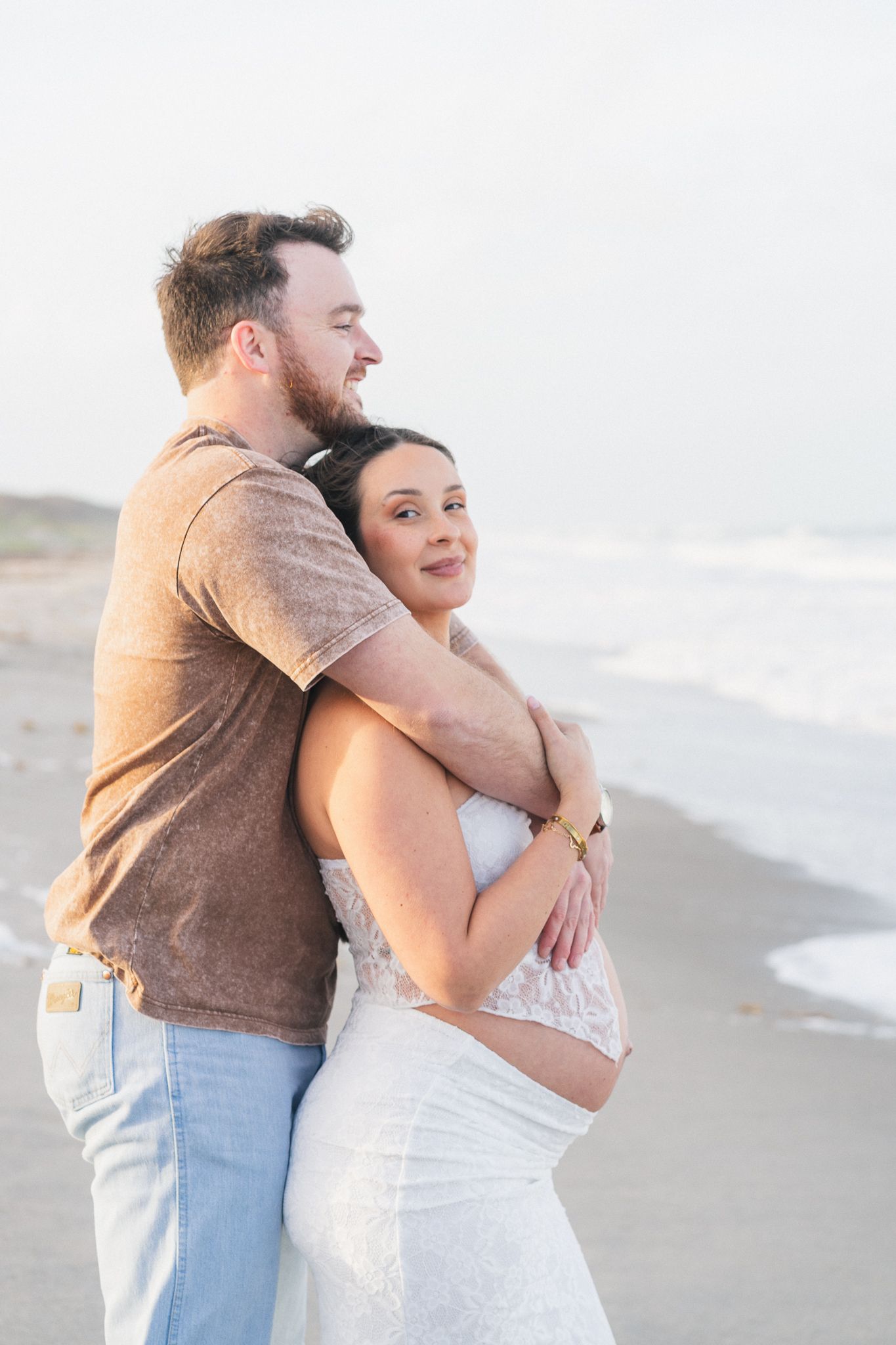 Light and airy beach couples engagement photography session on Brevard County beach