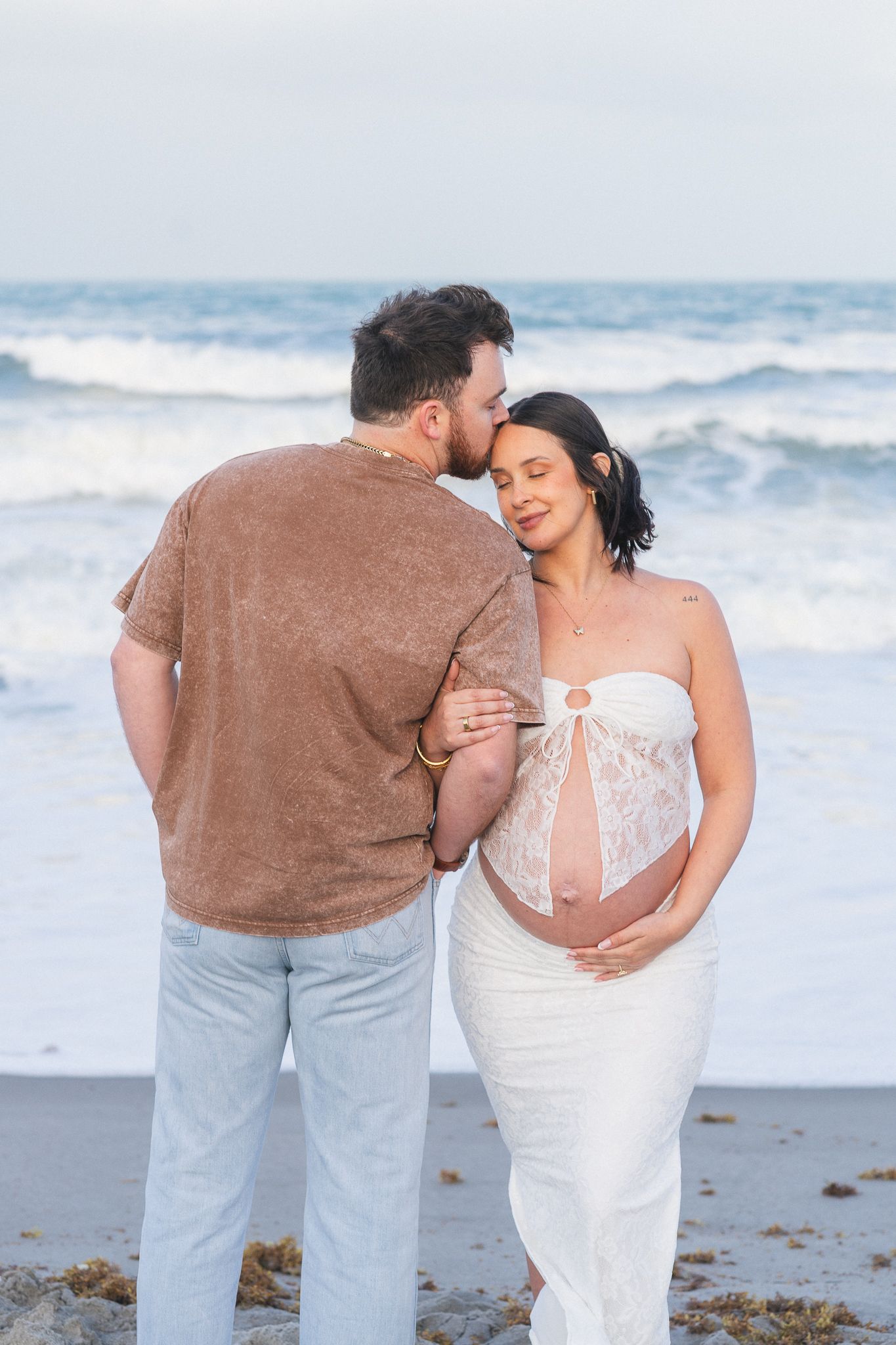 Light and airy beach couples engagement photography session on Brevard County beach