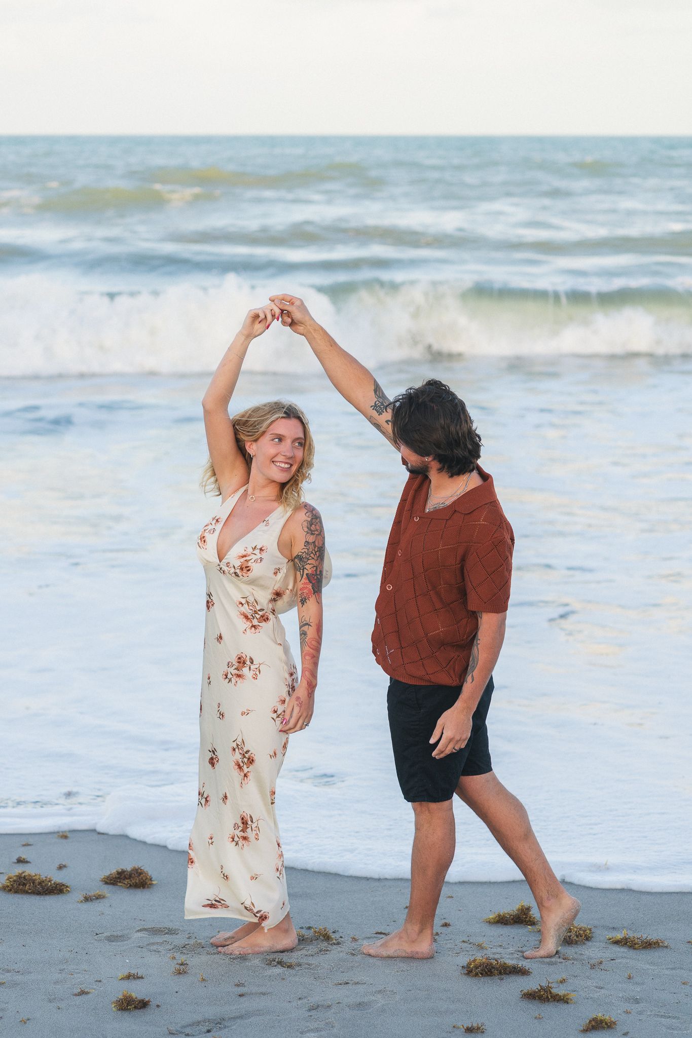 Light and airy beach couples engagement photography session on Brevard County beach