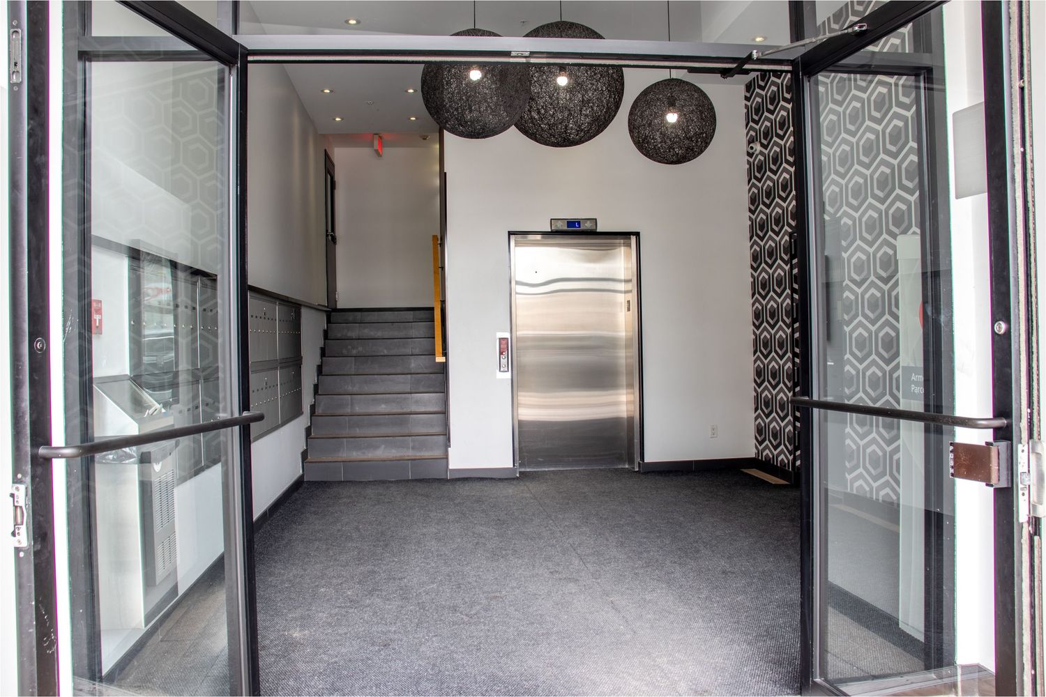 Bright interior space of a residential building in Montréal showcasing modern design, natural light and open layout