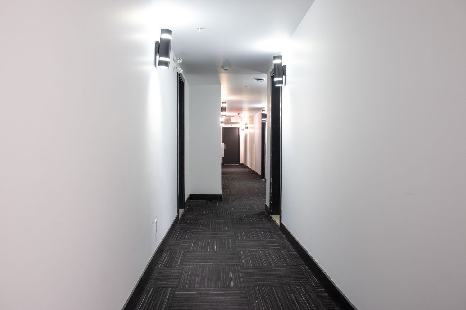 Bright interior space of a residential building in Montréal showcasing modern design, natural light and open layout