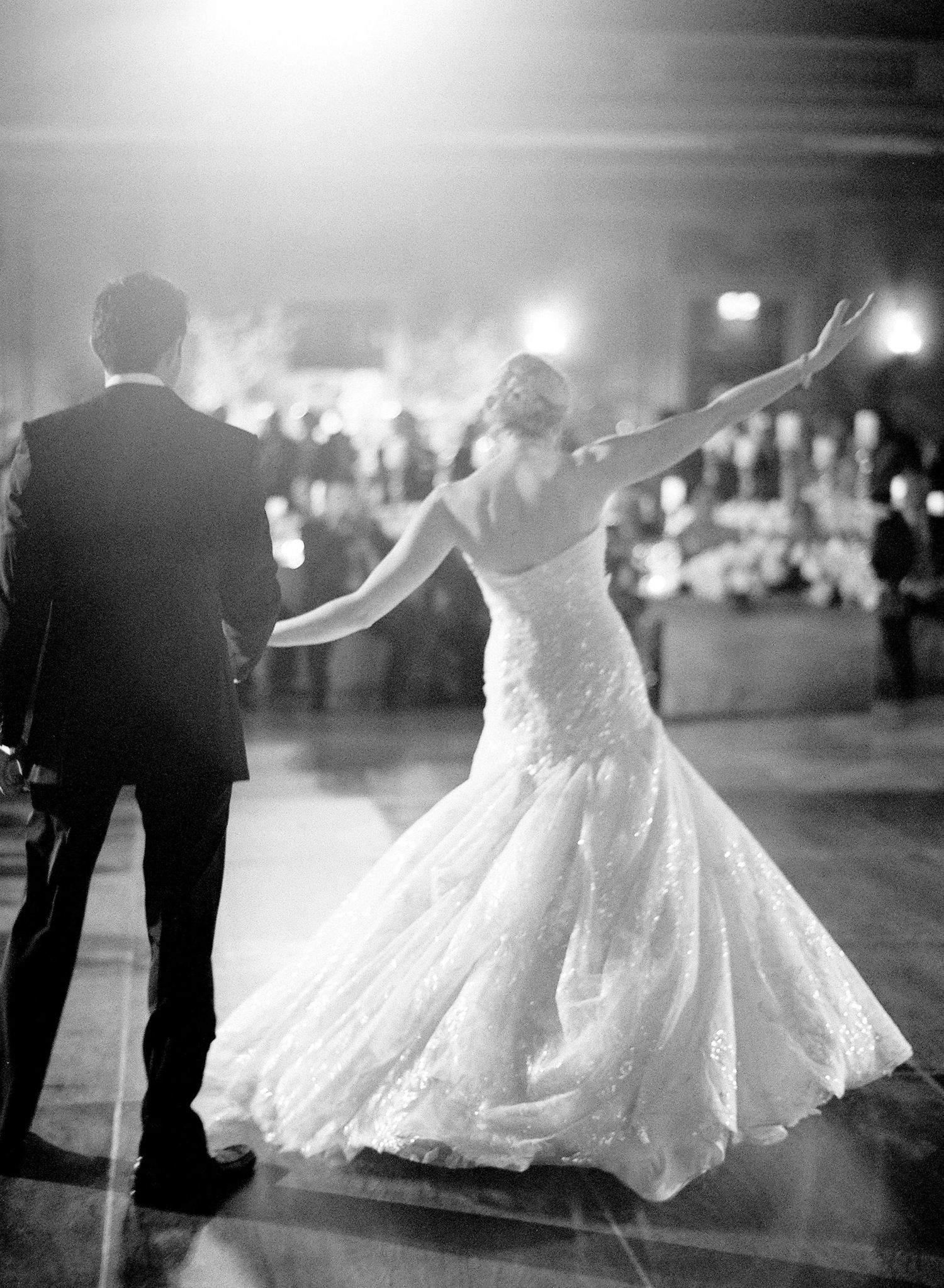 A romantic black and white photo sequence of a couple dancing in wedding attire, creating a dreamy motion effect.