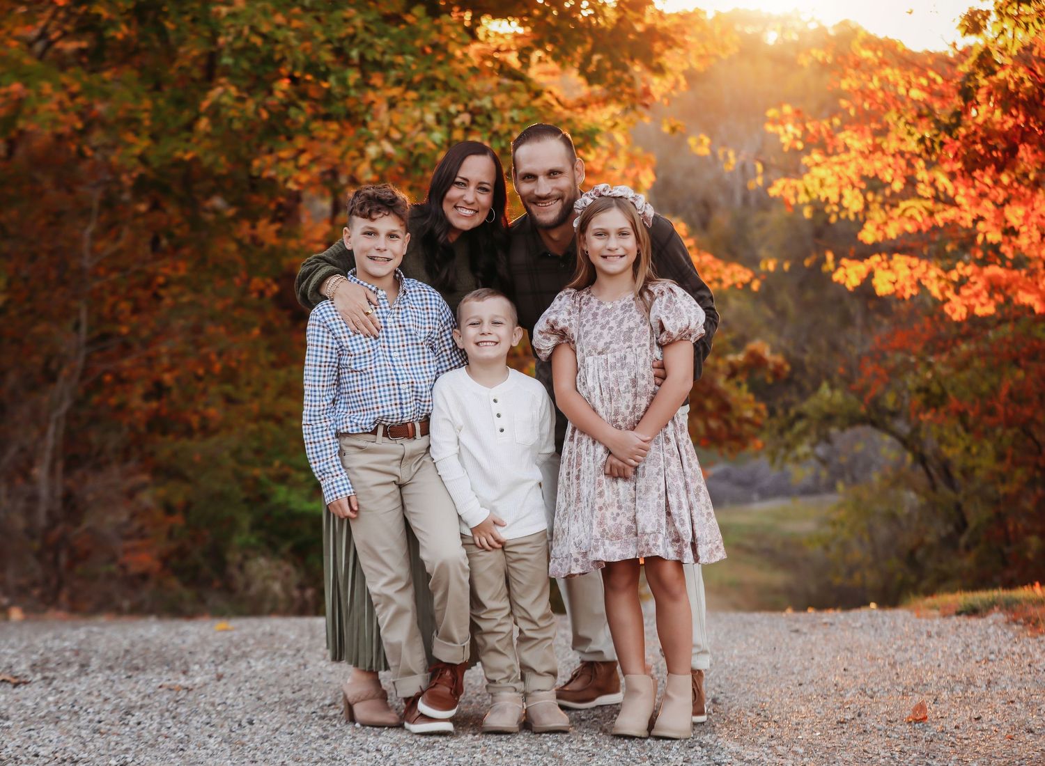 Family photo series at sunset with warm autumn colors and natural outdoor setting.
Best child's photographer in Illinois