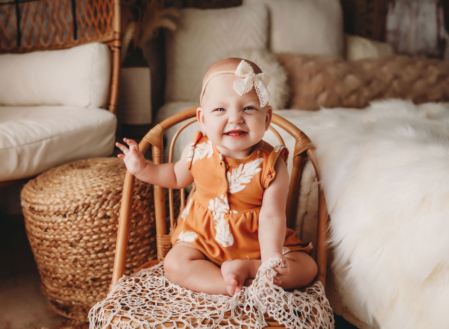A collection of lifestyle photos showing a baby in orange clothing sitting on woven baskets and white textiles.