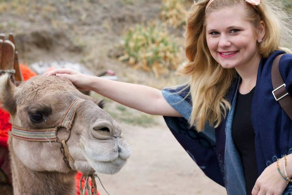 Photo of me with a camel during study abroad in 2014 in Cappadocia, Turkey — travel photography, nostalgic and soulful.
