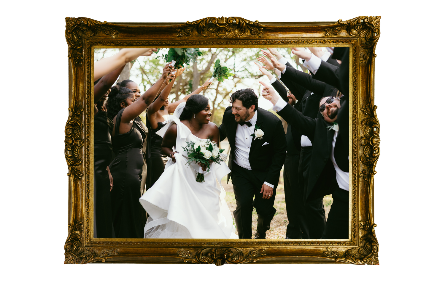 Wedding party celebrating with bride and groom in elegant attire, framed in ornate gold frame.