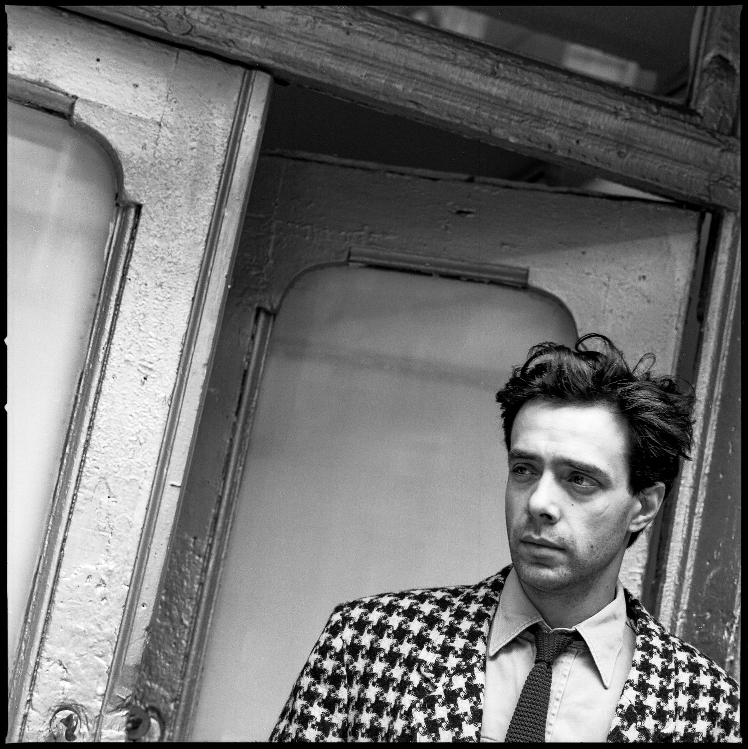 Colin de Land, art dealer in front of his Vox Populi gallery, East Village, NYC.