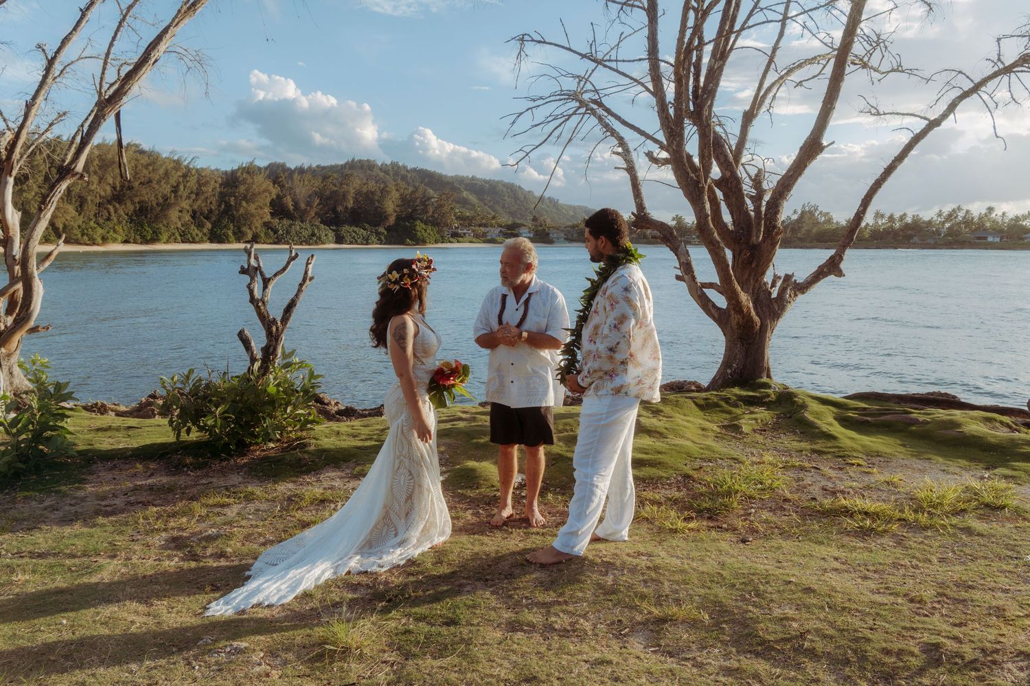 Emotional ring exchange at sunset in a Hawaii elopement