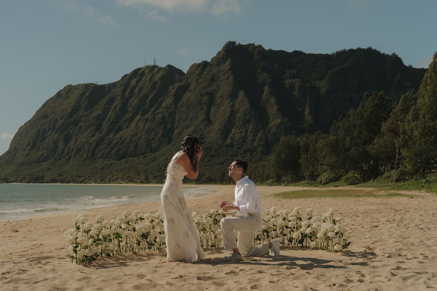 Hawaii surprise proposal on the beach with flower arragenment setup