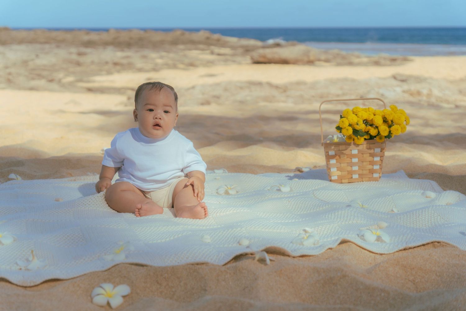 Smiling baby with tropical lei during Hawaii family session