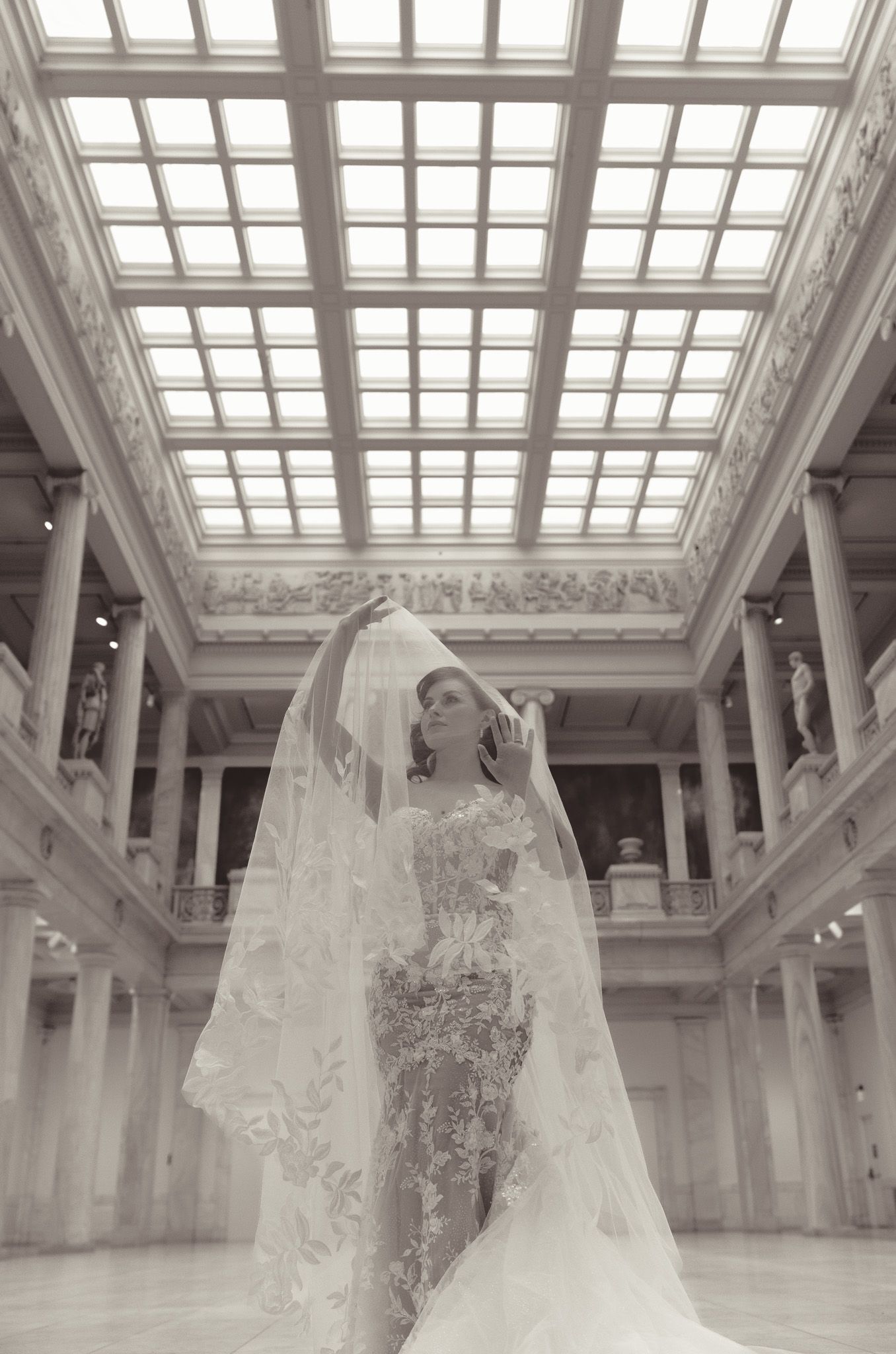 Dramatic bridal portrait in grand hall with ornate skylight and classical architecture  at Carnegie Museum in Pittsburgh, pa.