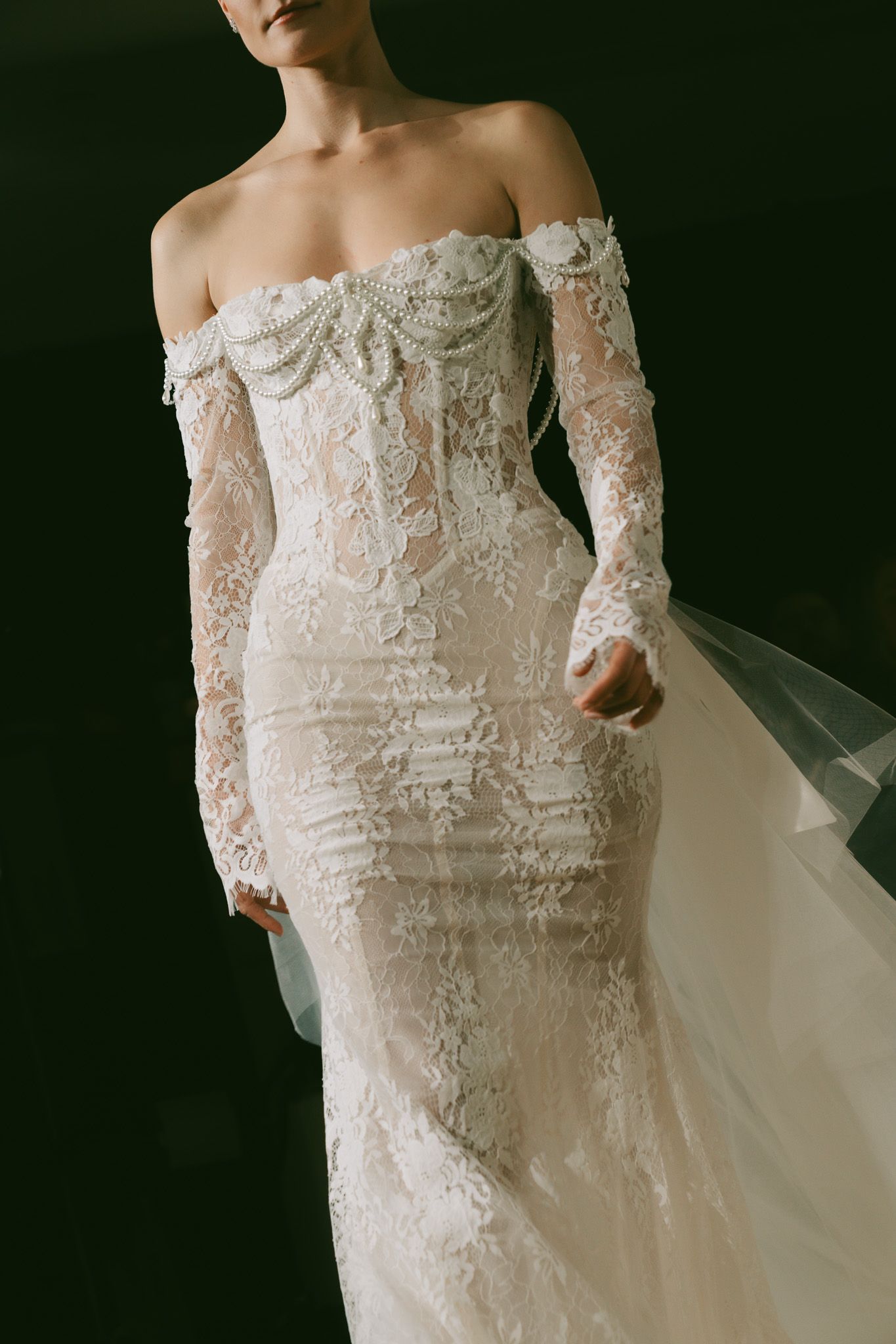 Off-shoulder lace Berta wedding gown with intricate beadwork and flowing veil.