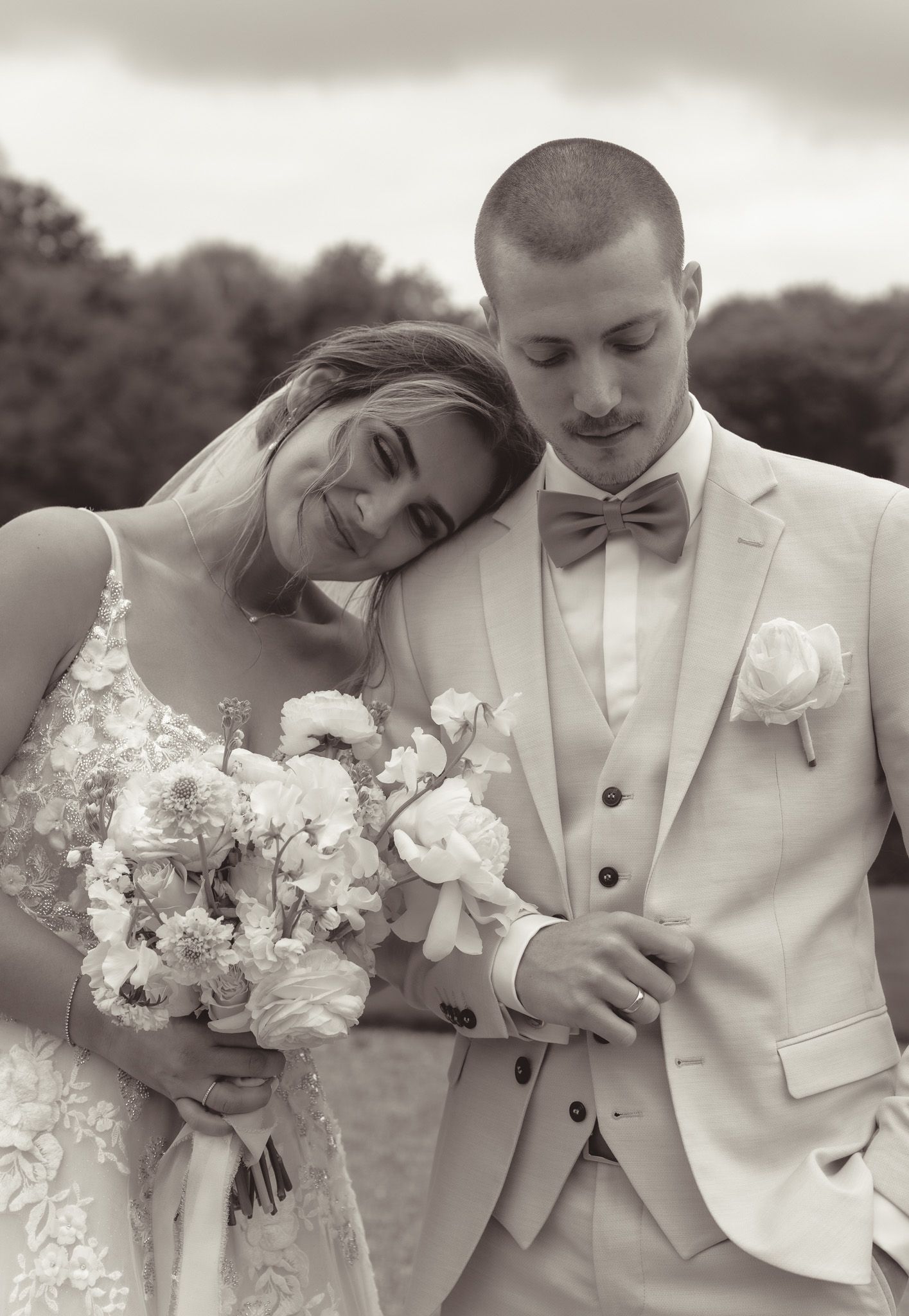 Romantic wedding couple posing together in light formal attire in Germany.