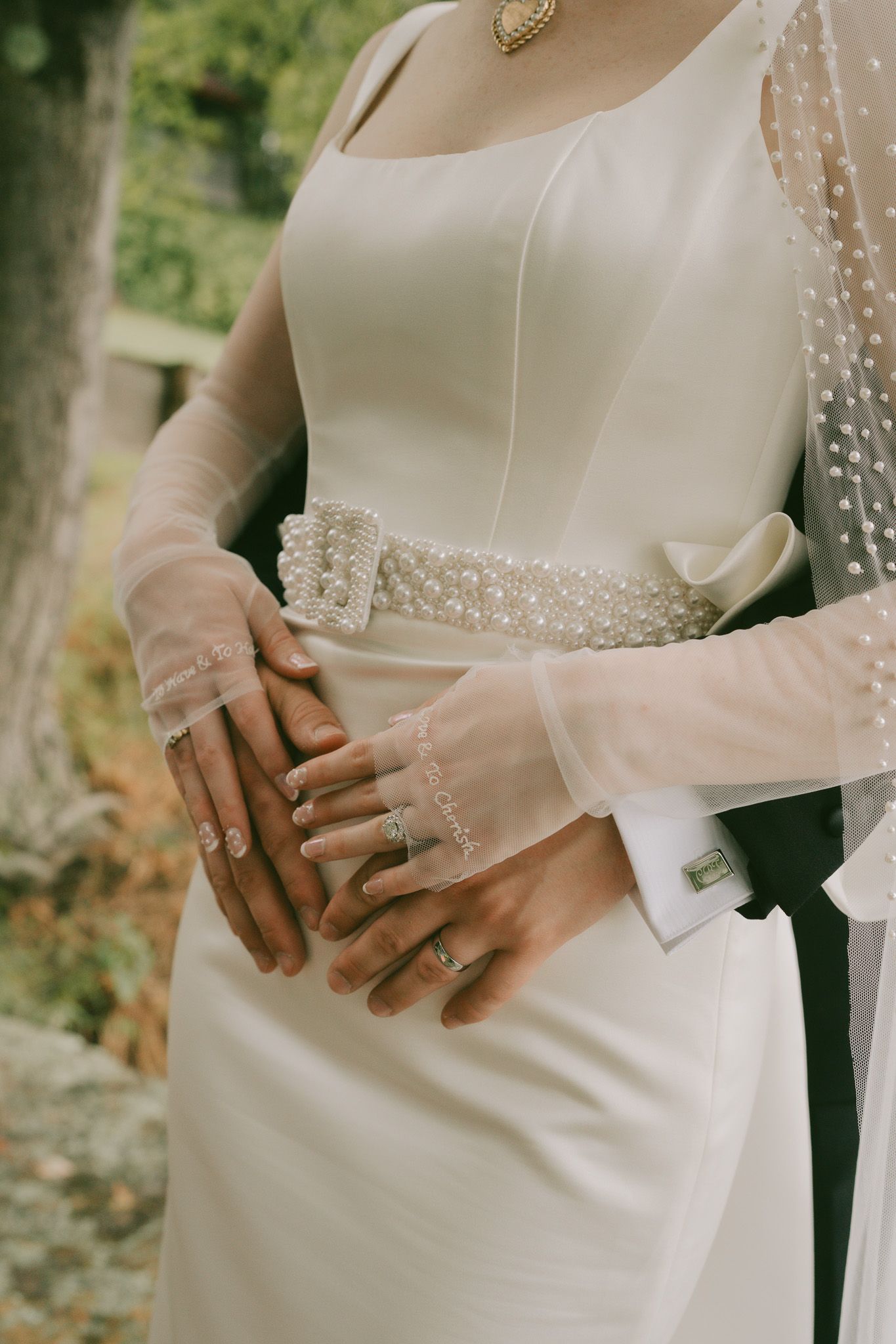 Close-up details of elegant wedding dress with pearl embellishments in pittsburgh, pa.