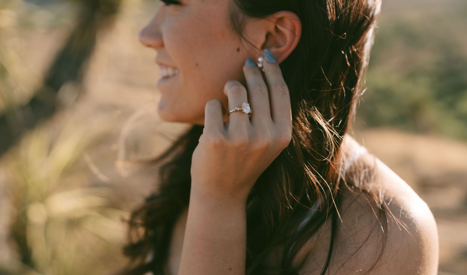 Close-up profile shot of elegant bridal jewelry and styling from Suma Jewlery Co in the desert.